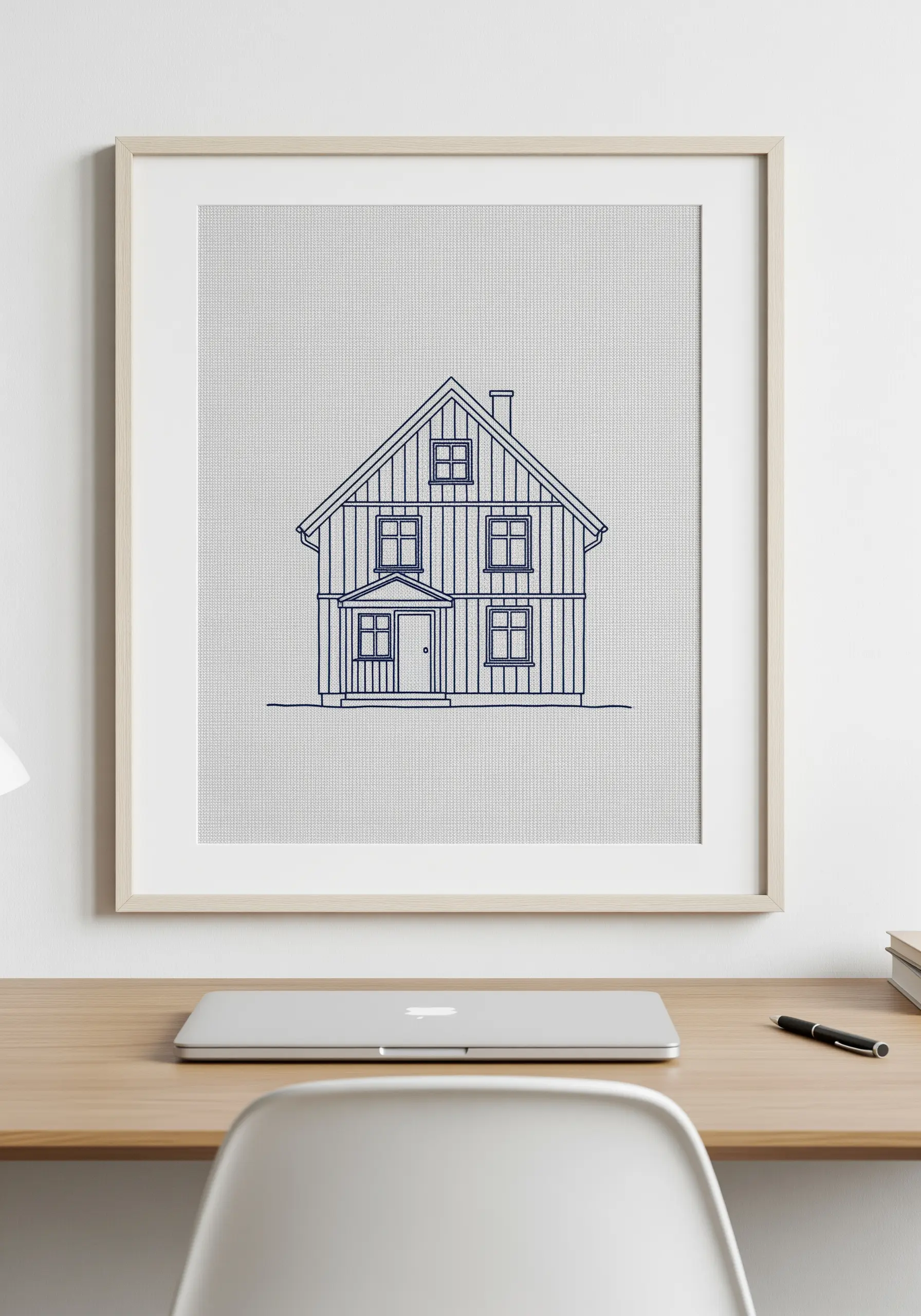 Architectural line art embroidery of a Scandinavian-style house.