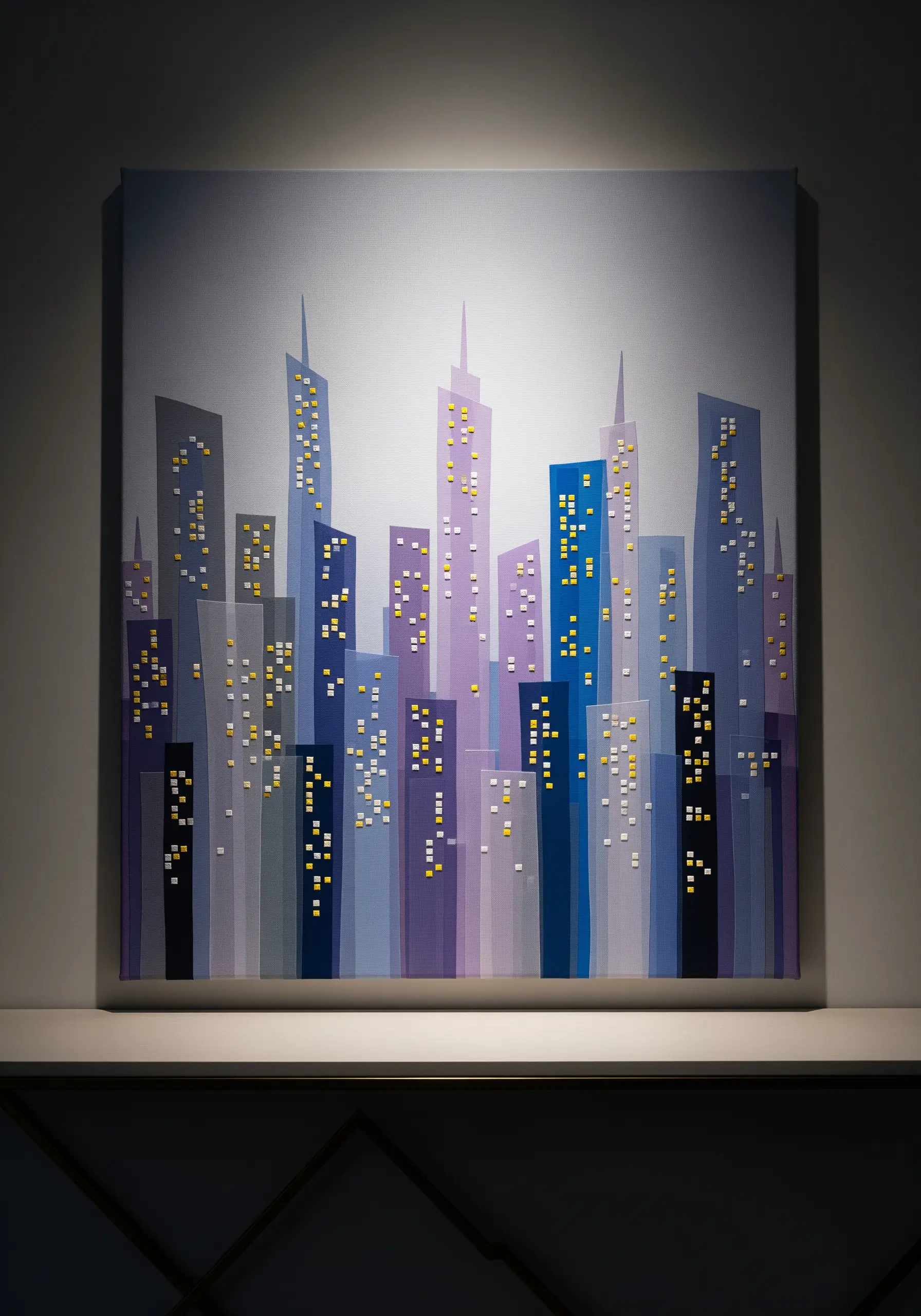 A fabric collage cityscape on canvas using layered purple and blue fabrics to show perspective.