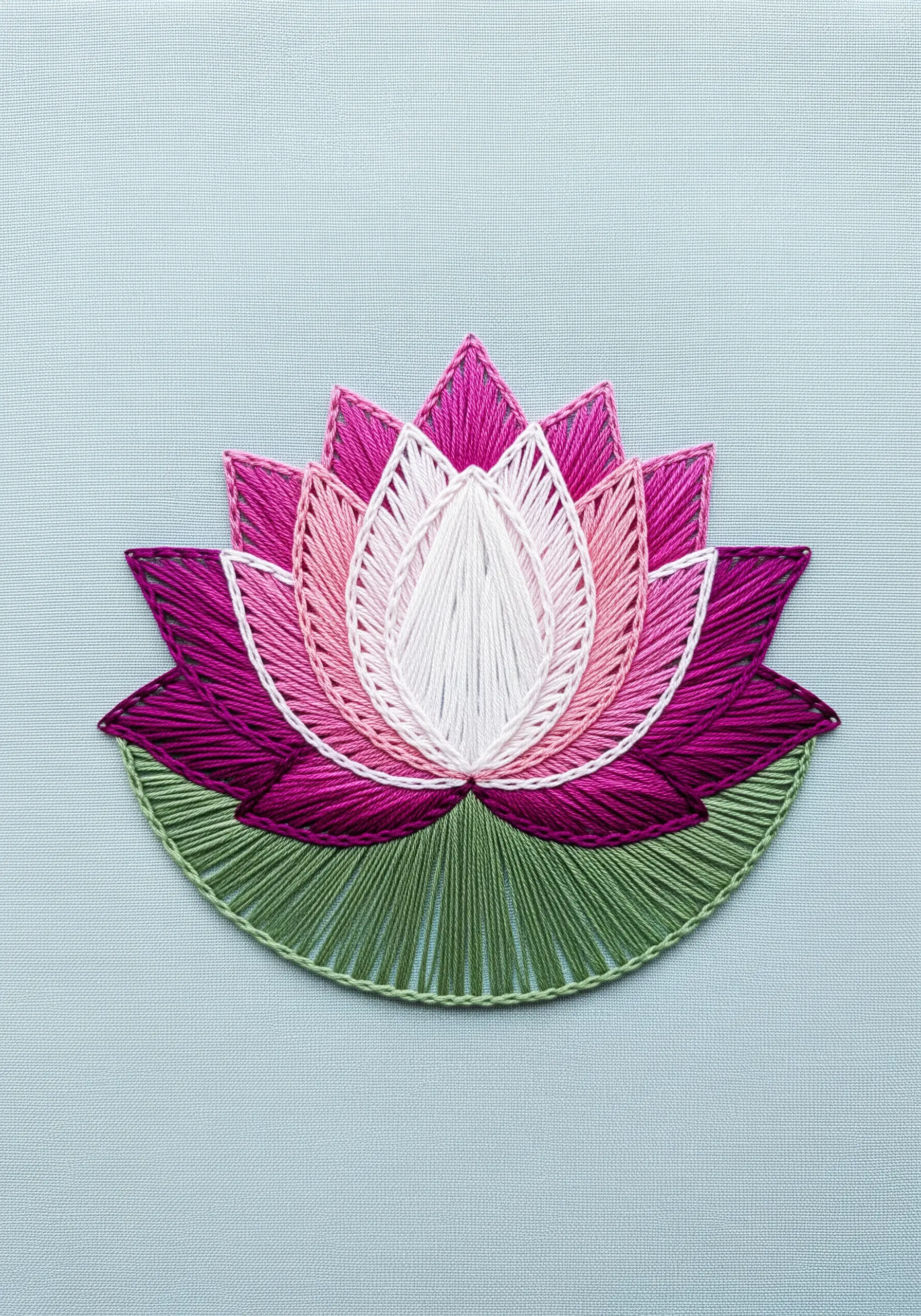 A string art lotus flower with pink, magenta, and white gradient petals.