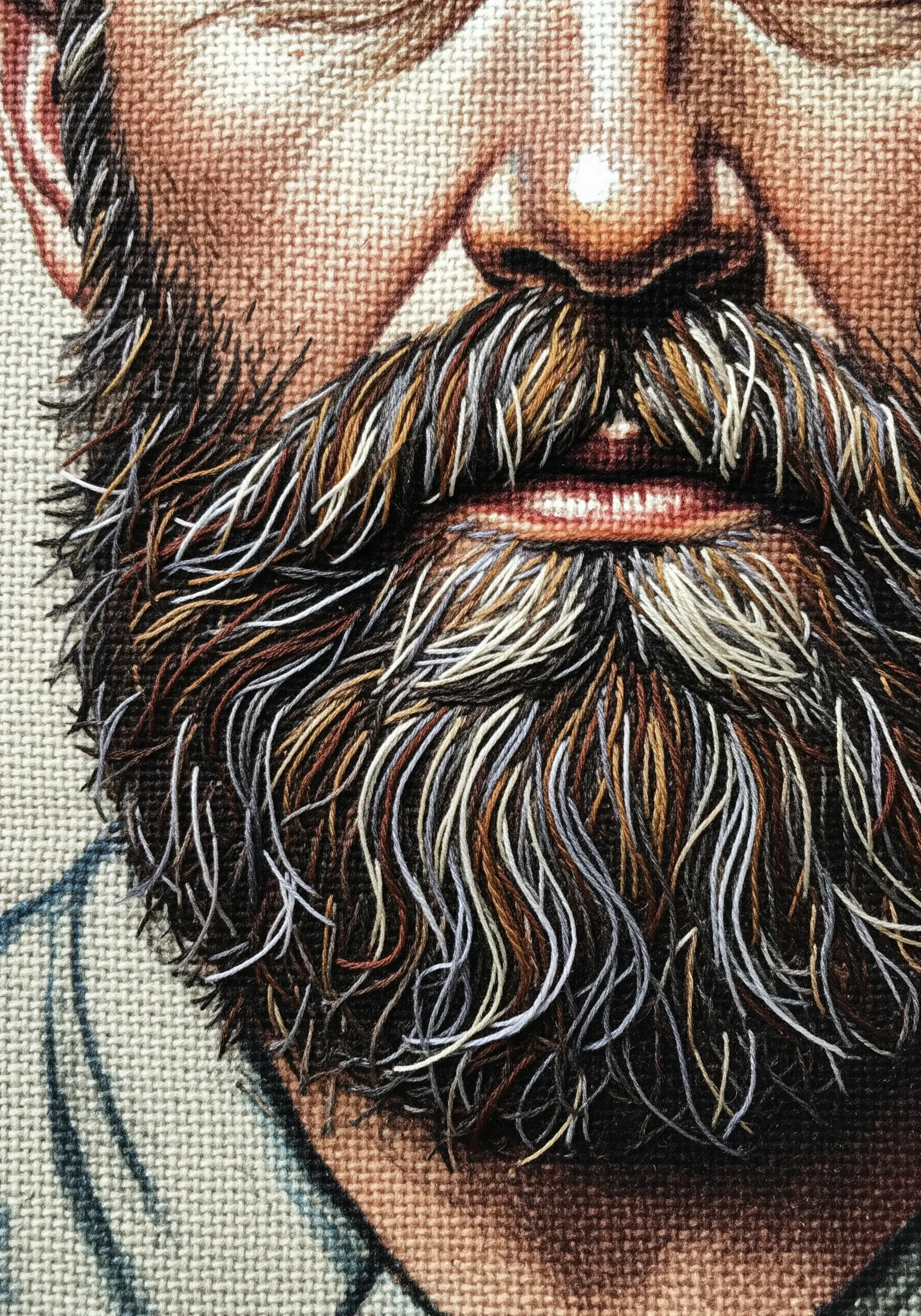 Detailed close-up of a realistic, multi-colored embroidered beard with individual thread hairs.