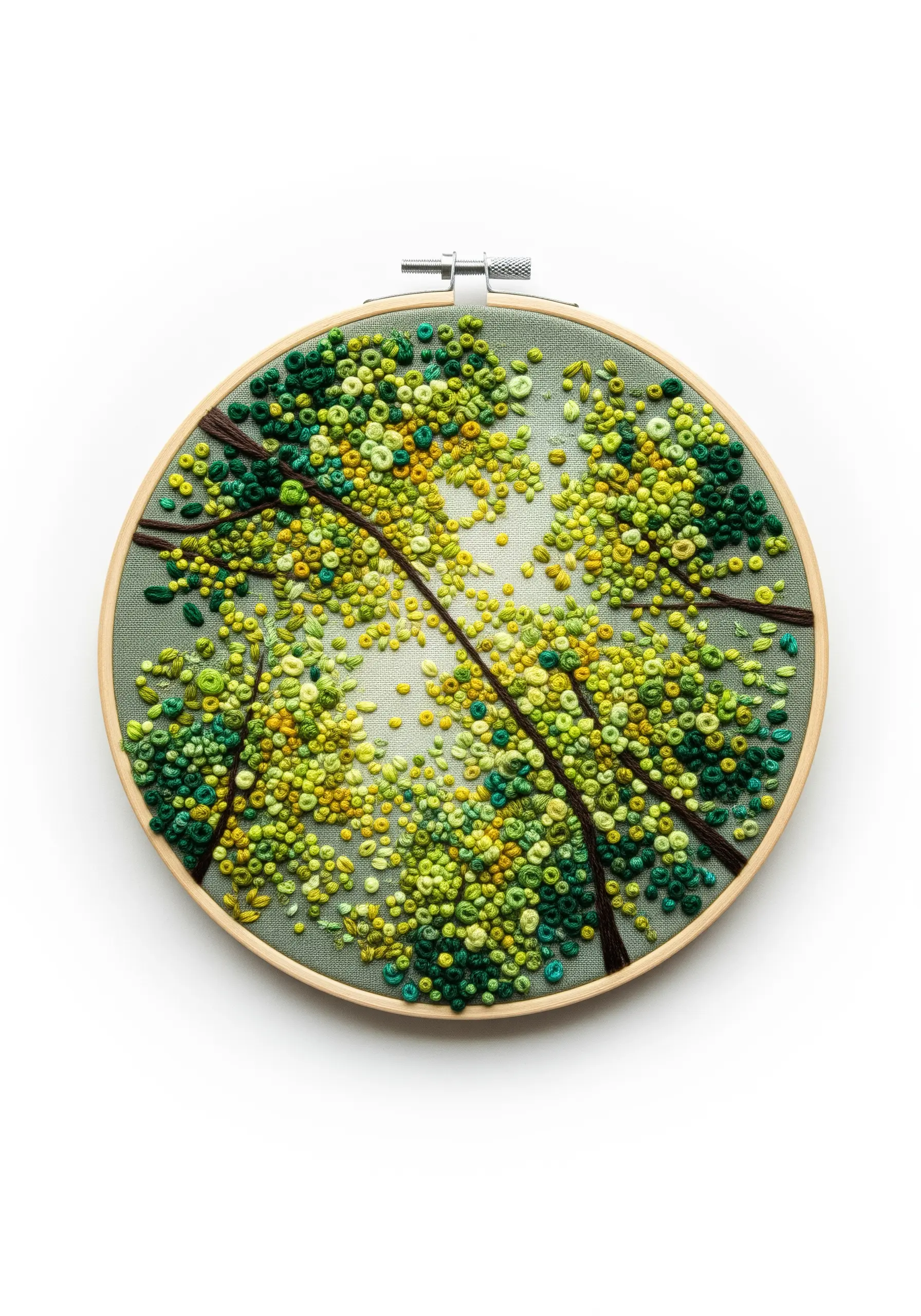 Embroidery of tree canopies viewed from below, using dense green and yellow French knots.