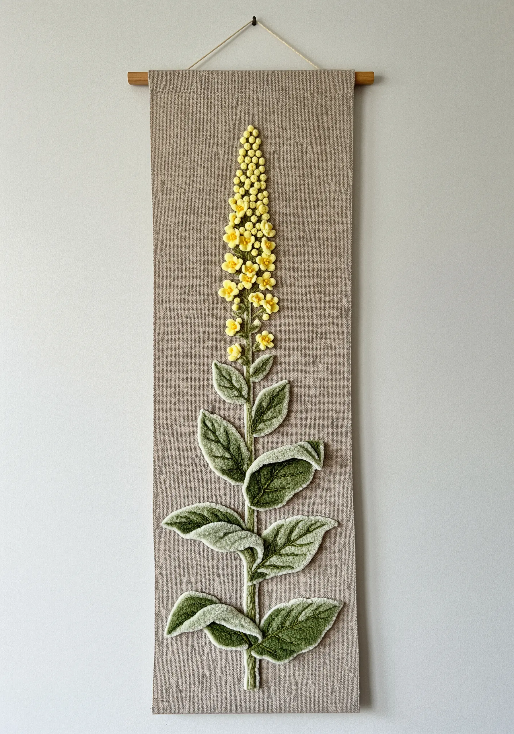 A 3D embroidered mullein stalk on a narrow wall hanging, with raised, textured leaves.