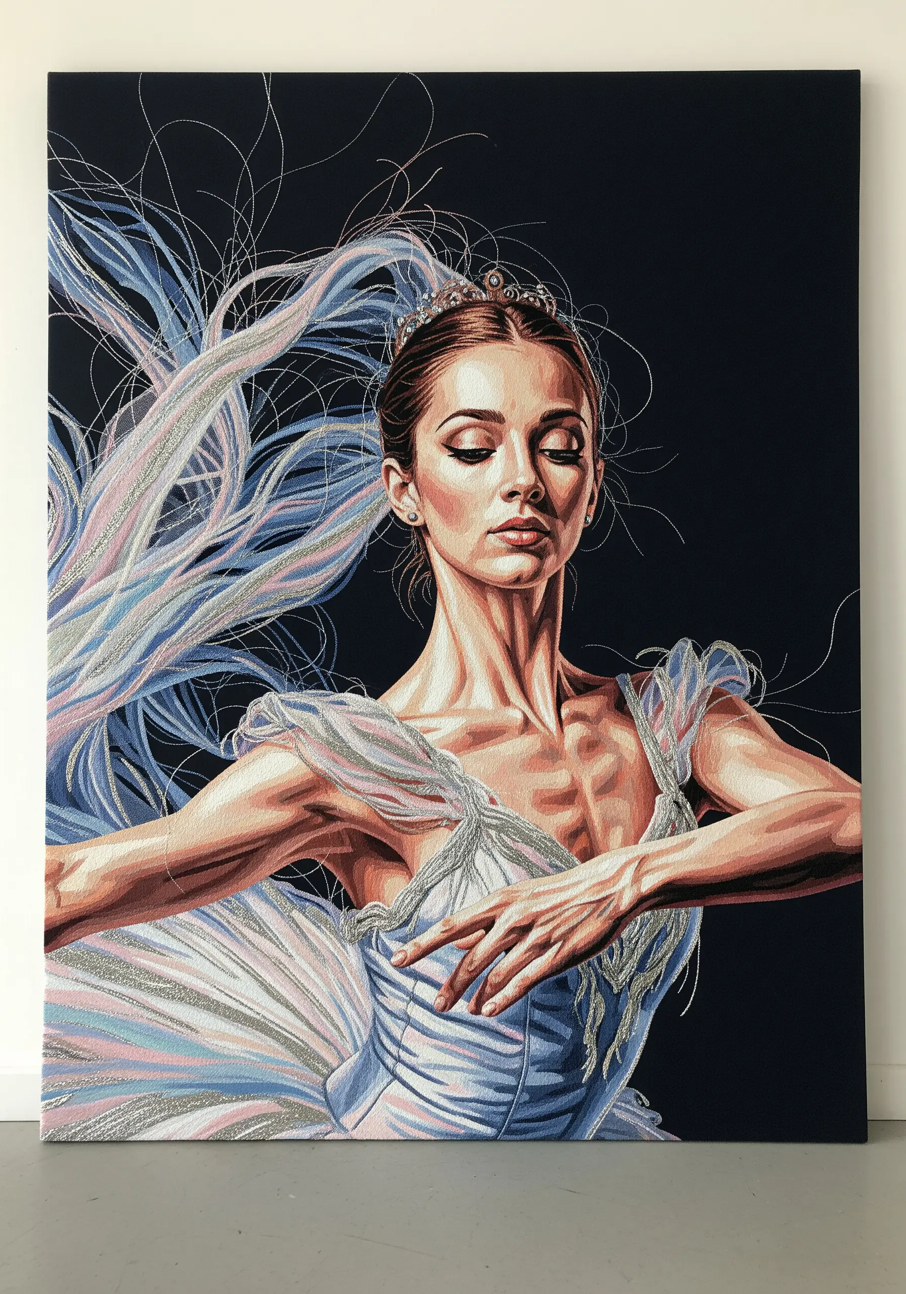 Embroidered portrait of a ballerina with flowing threads creating a sense of movement.