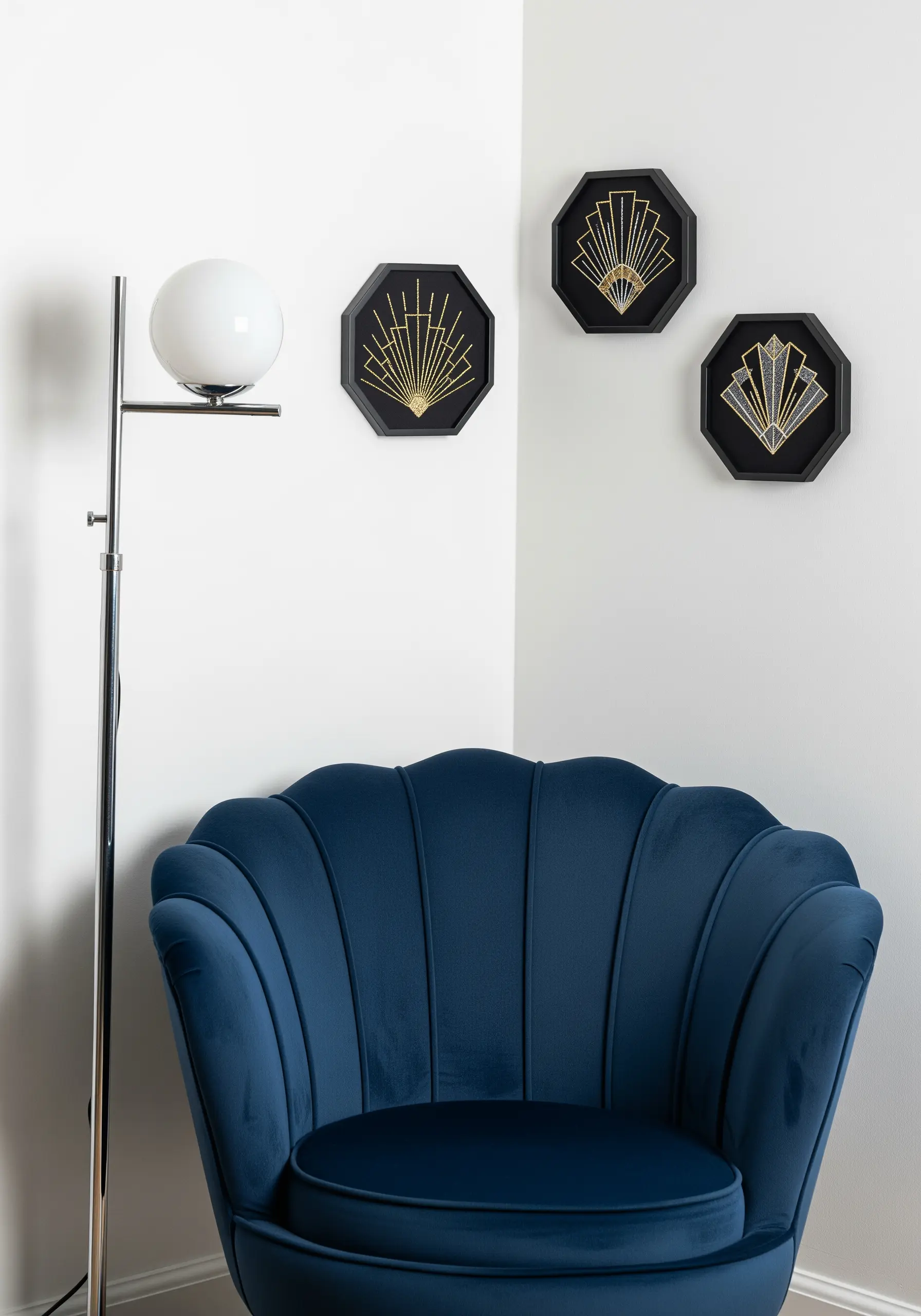 Three octagonal frames with gold Art Deco fan embroidery on black fabric.