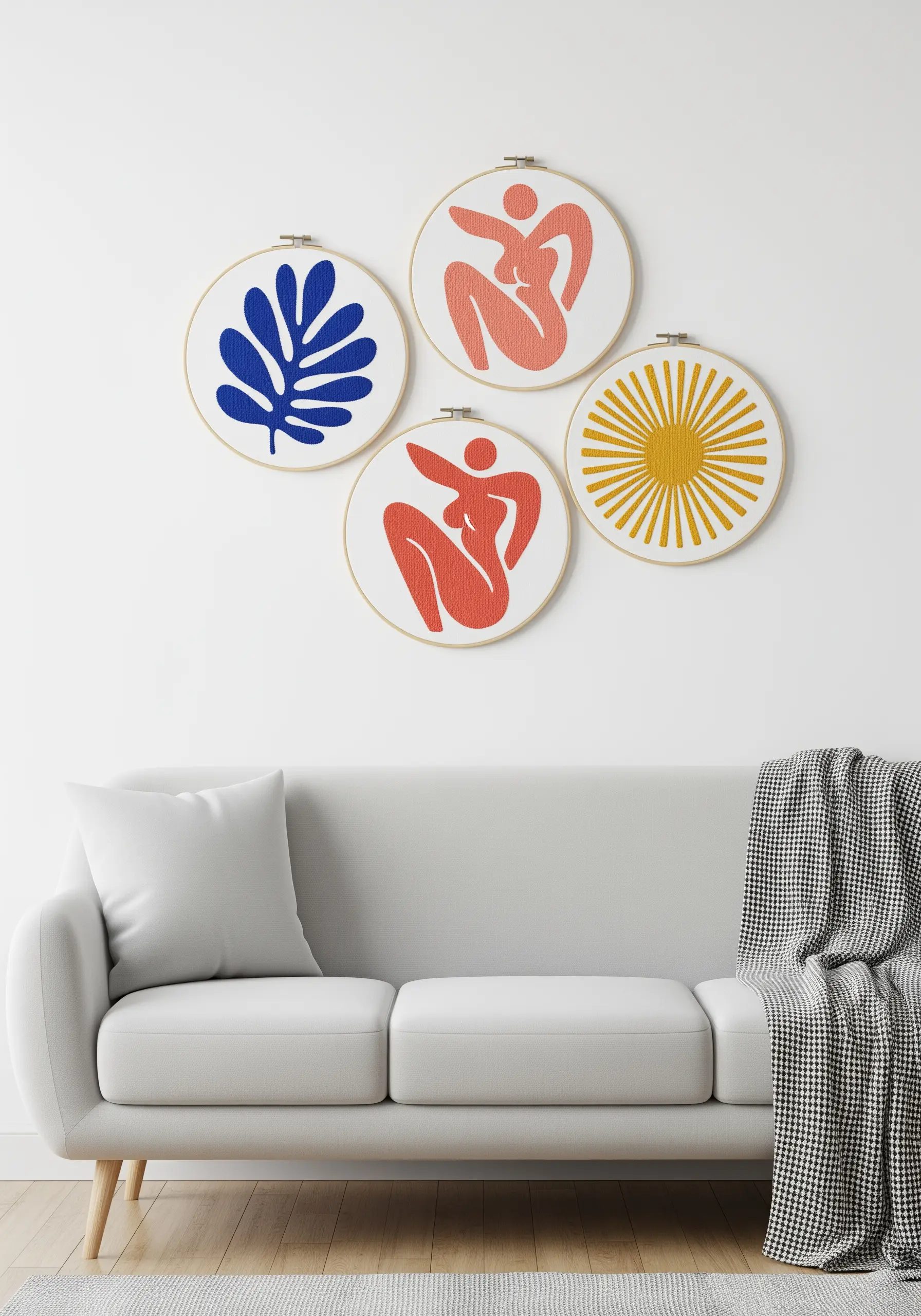 A set of four embroidery hoops featuring abstract, Matisse-inspired figures and shapes.