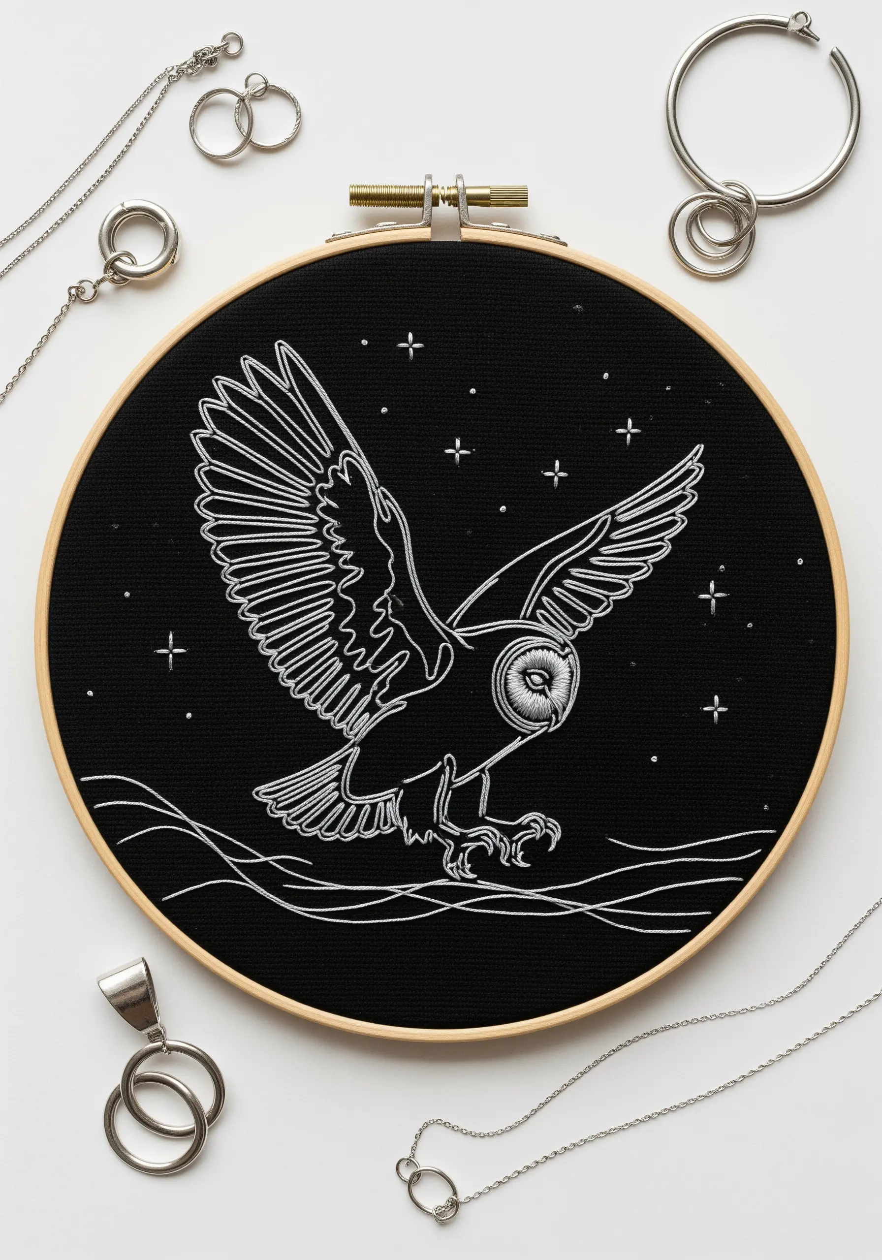 Minimalist line art of an owl in flight, stitched in bright white thread on a black background.