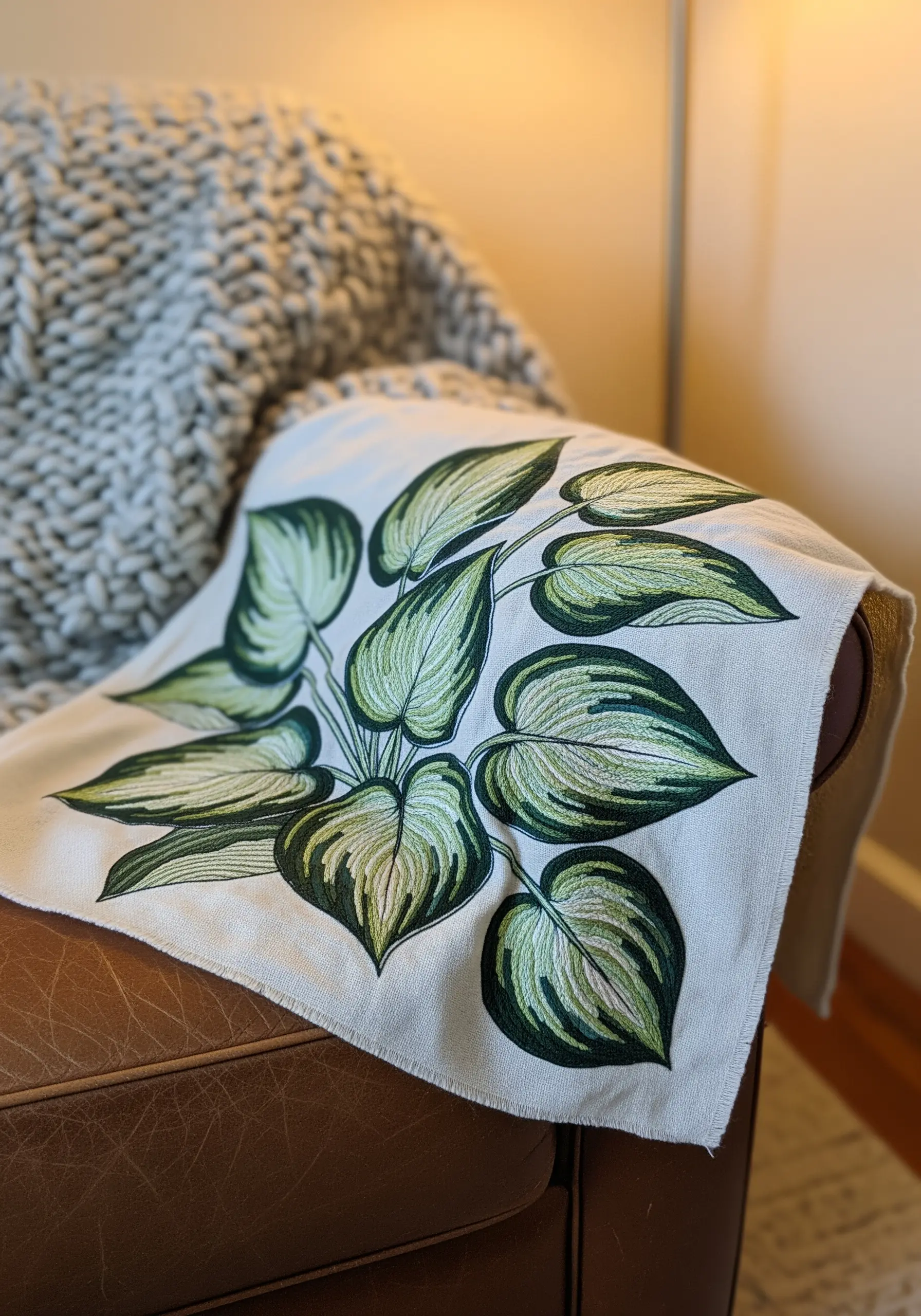 Realistic Hosta leaves embroidered with variegated green and cream thread
