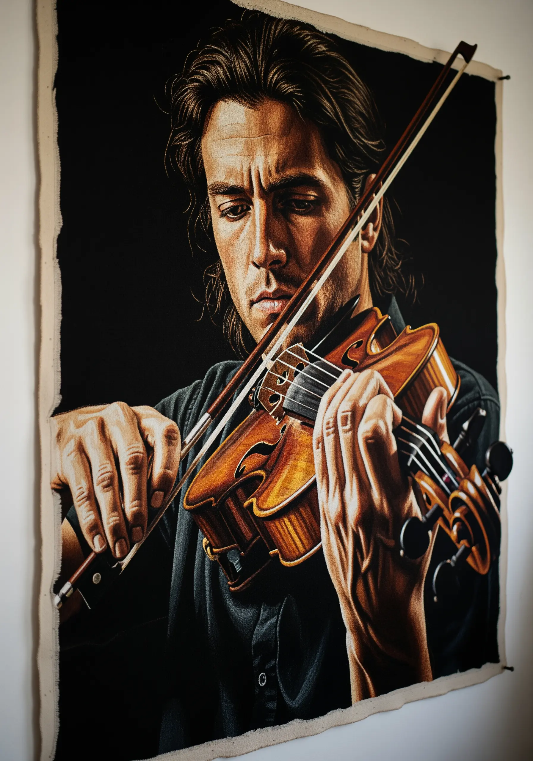 Detailed embroidered portrait of a man playing the violin, focusing on light and shadow.