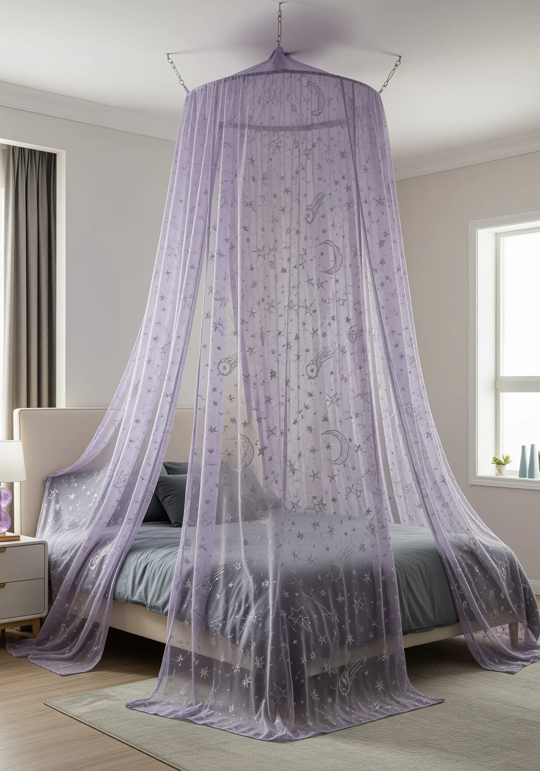 A sheer lavender bed canopy embroidered with silver celestial patterns like stars and moons.