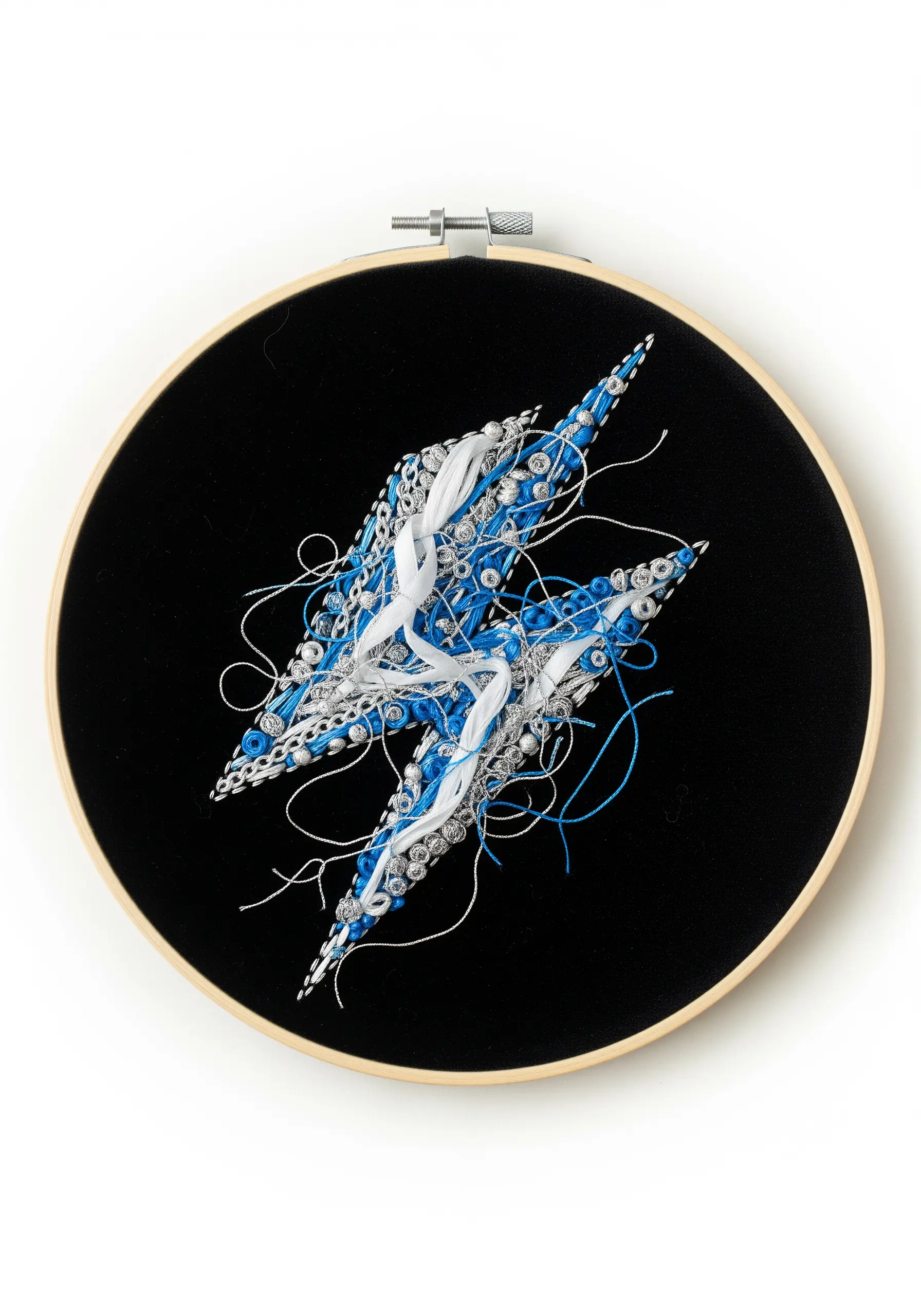 A lightning bolt filled with a chaotic mix of beads, chains, ribbons, and metallic threads.