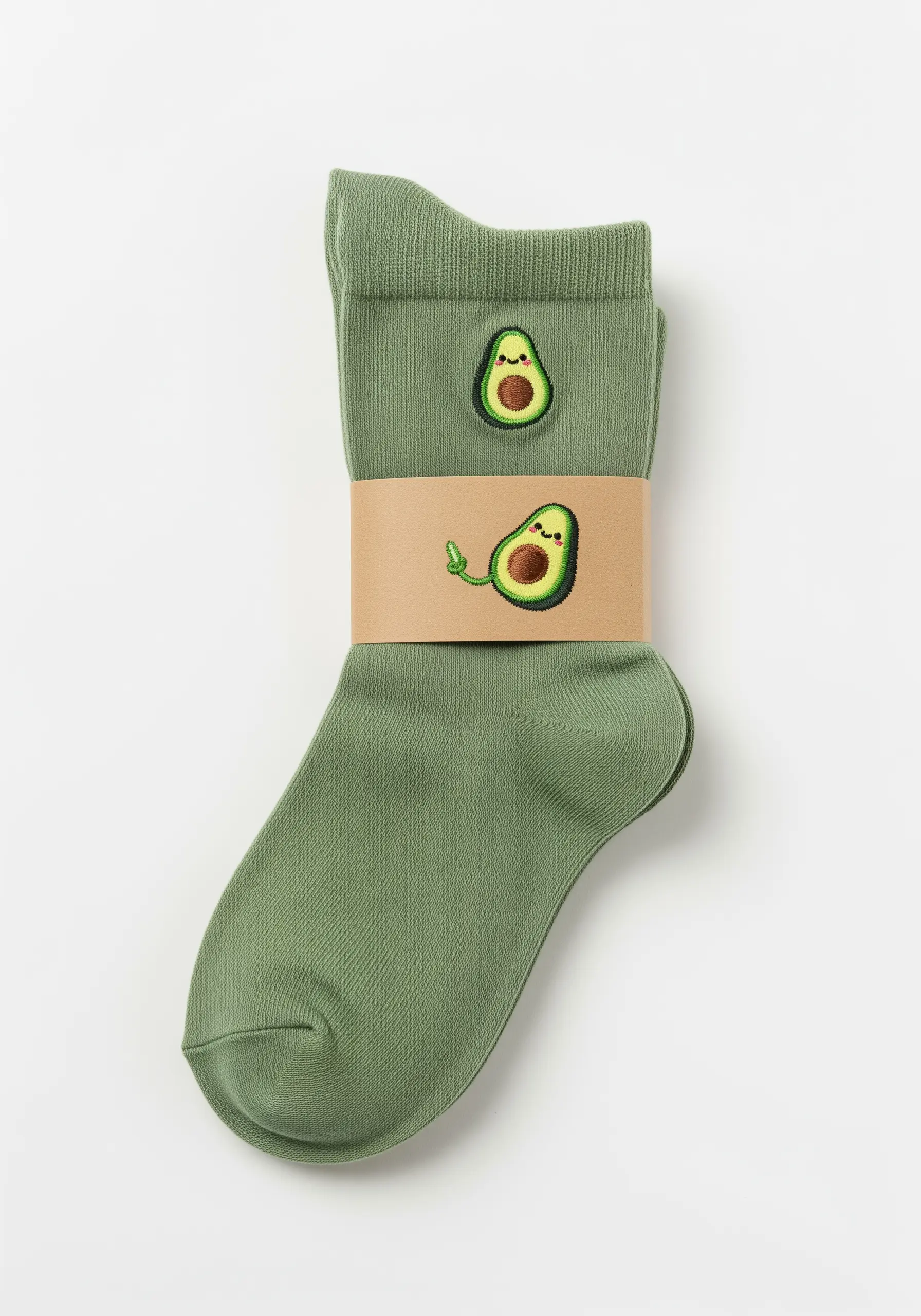 A pair of green socks with a small, smiling avocado character embroidered on them.