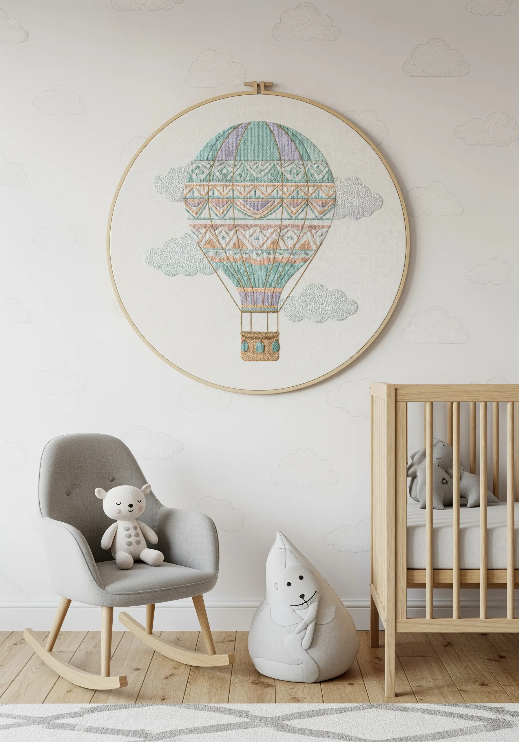 A large, detailed cross-stitch of a hot air balloon in a nursery room.