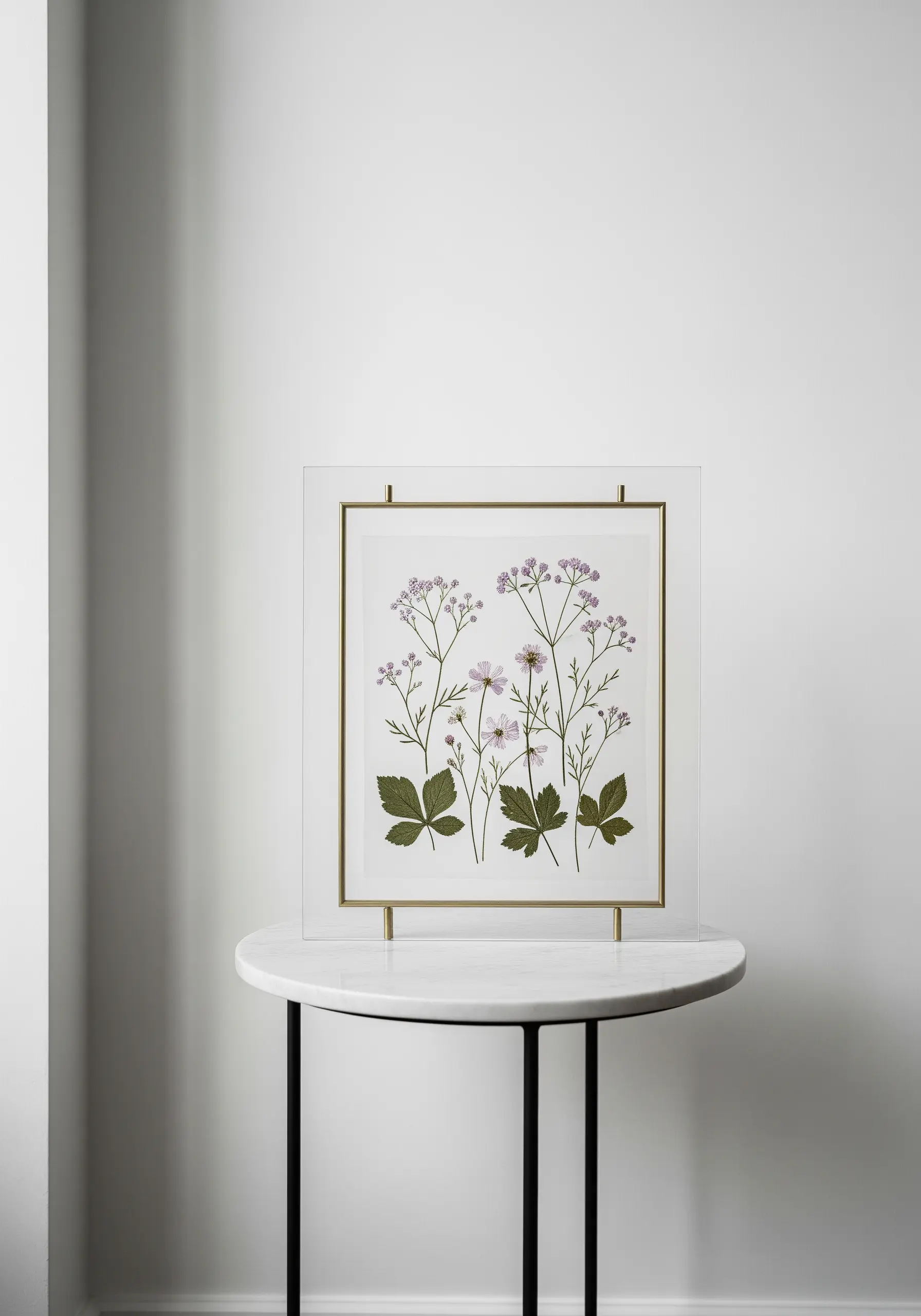 Embroidered stems combined with real pressed flowers, displayed in a modern floating frame.