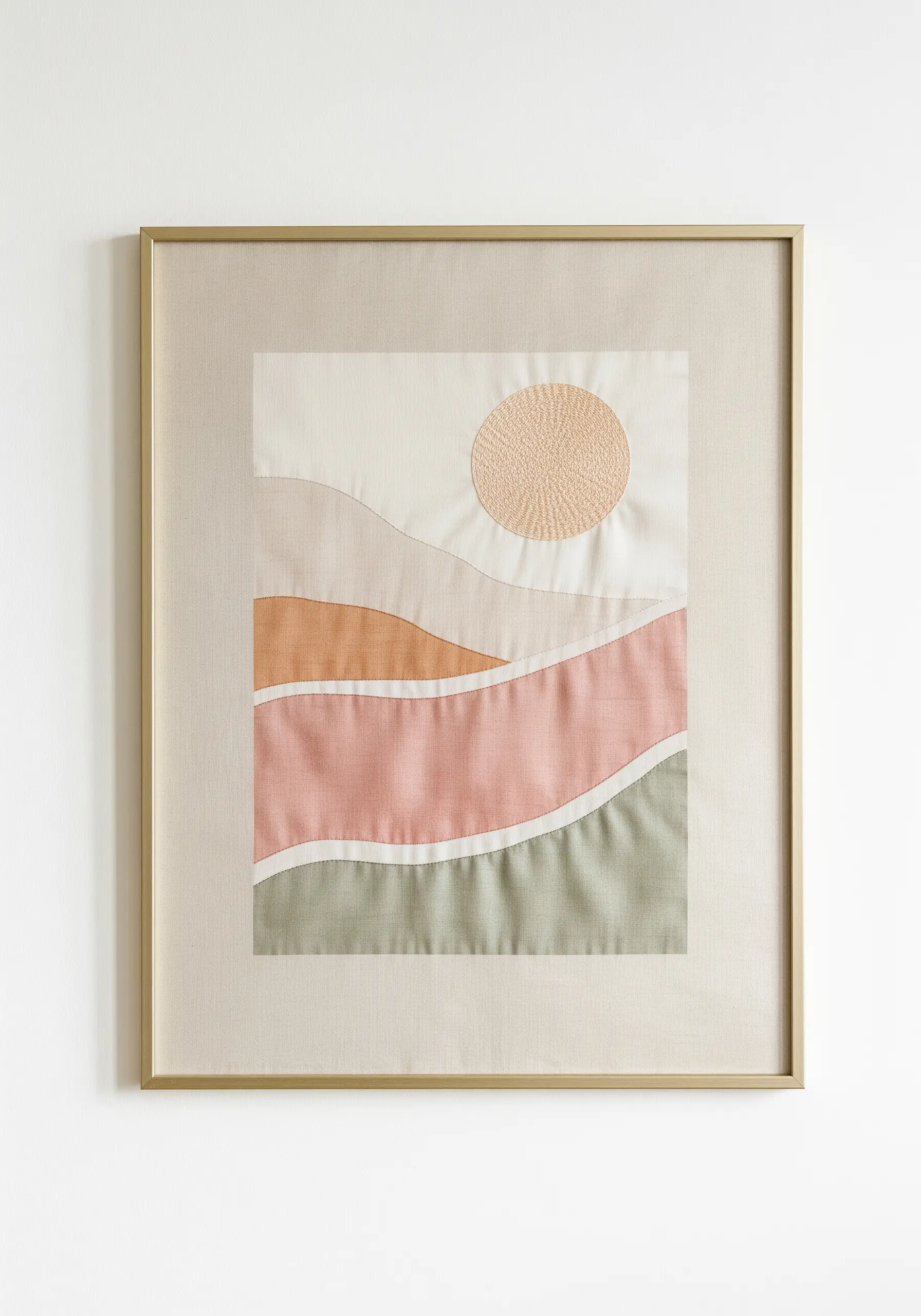 Framed fabric collage of a minimalist landscape with layered pastel fabrics and stitched sun.