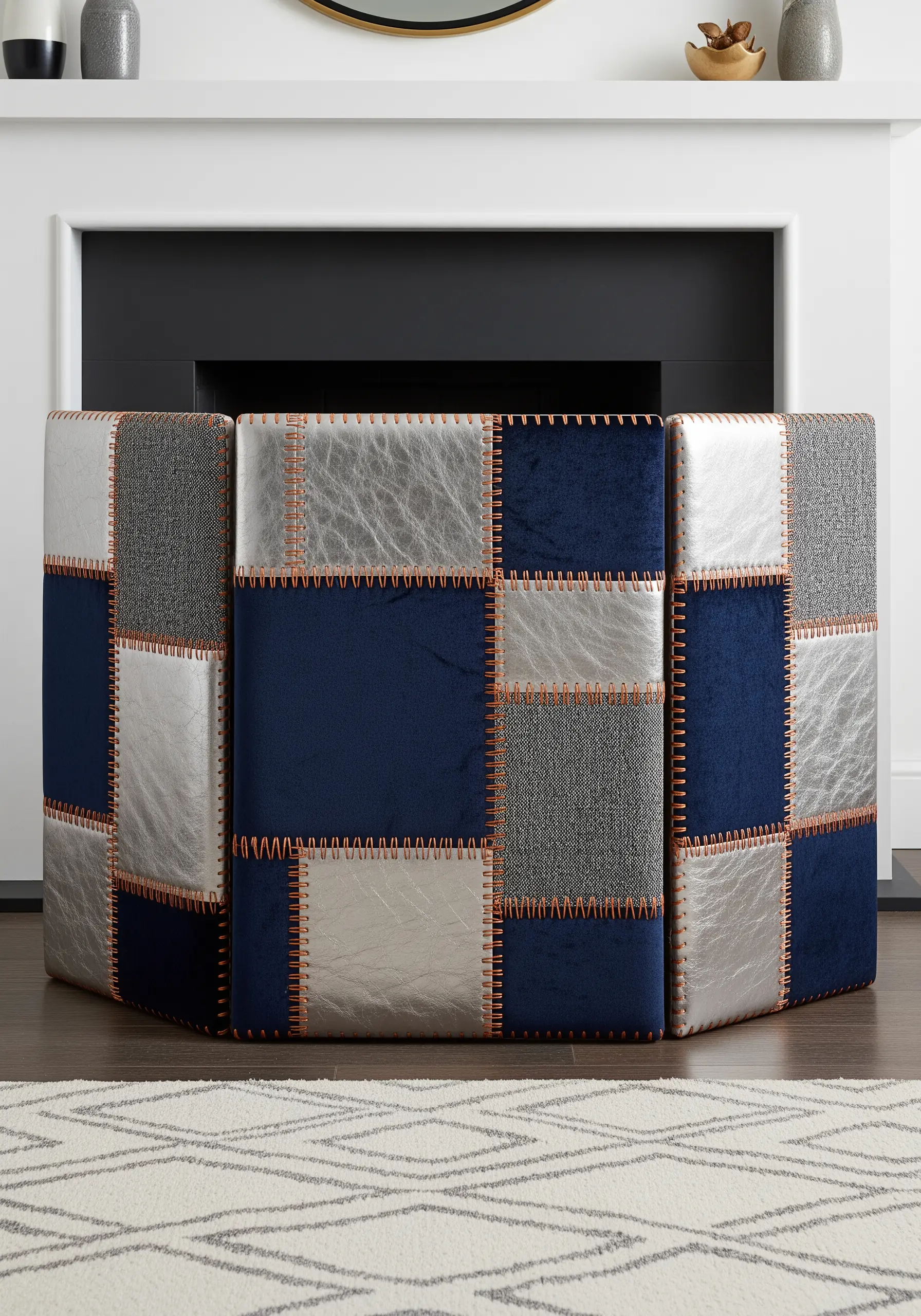 A three-panel fireplace screen made from a patchwork of blue, grey, and silver fabrics.
