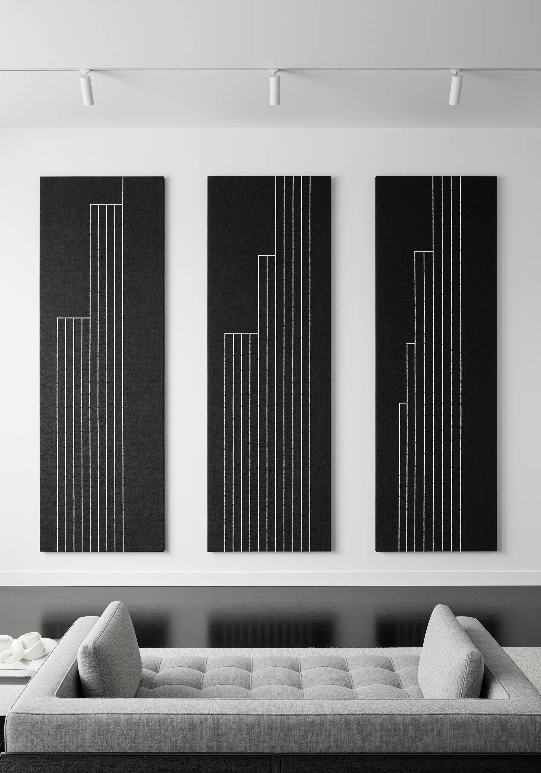 A triptych of black canvases with minimalist white vertical stitched lines resembling buildings.