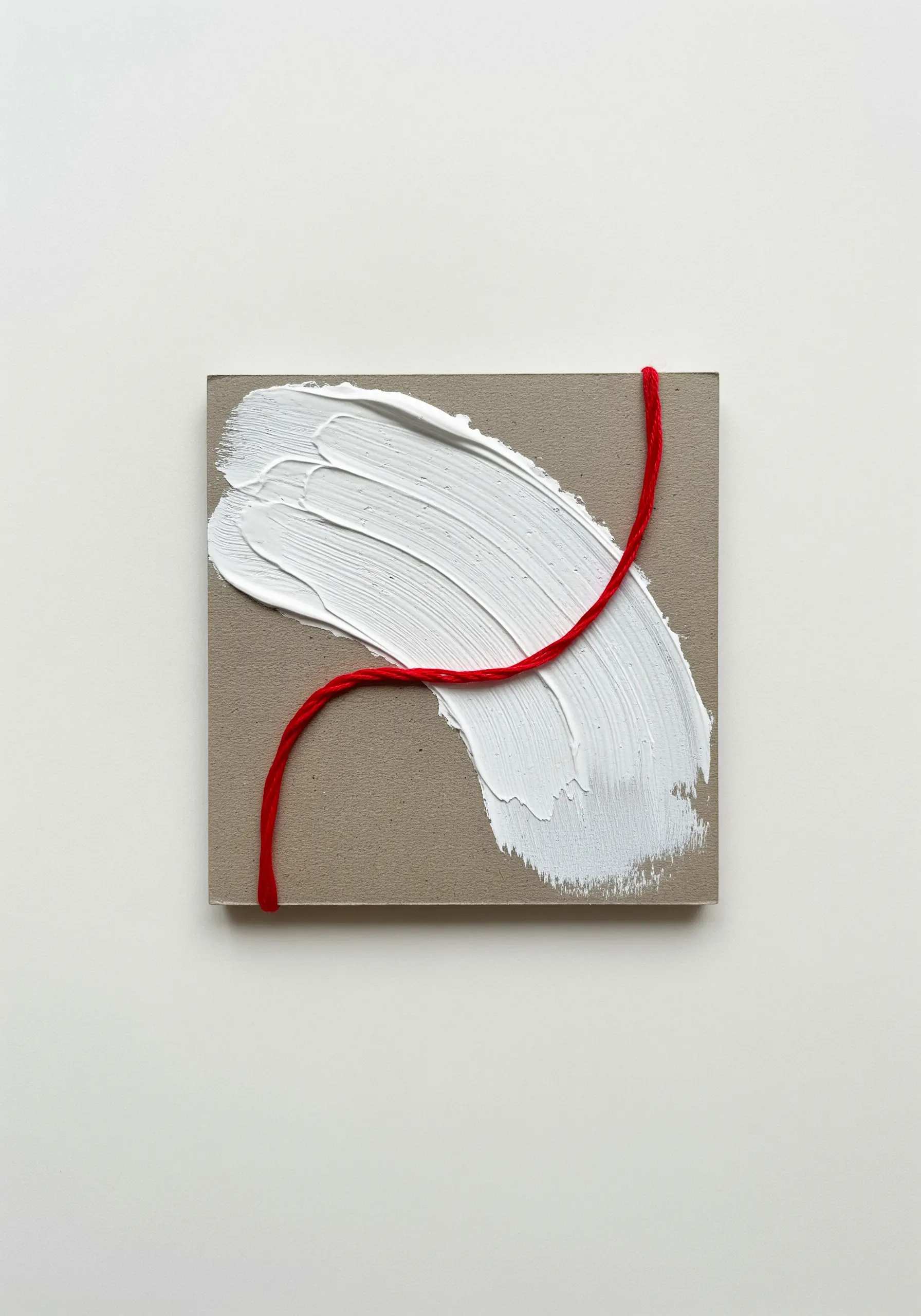 Thick white impasto paint on a small board, contrasted by a single red thread stitched across it.