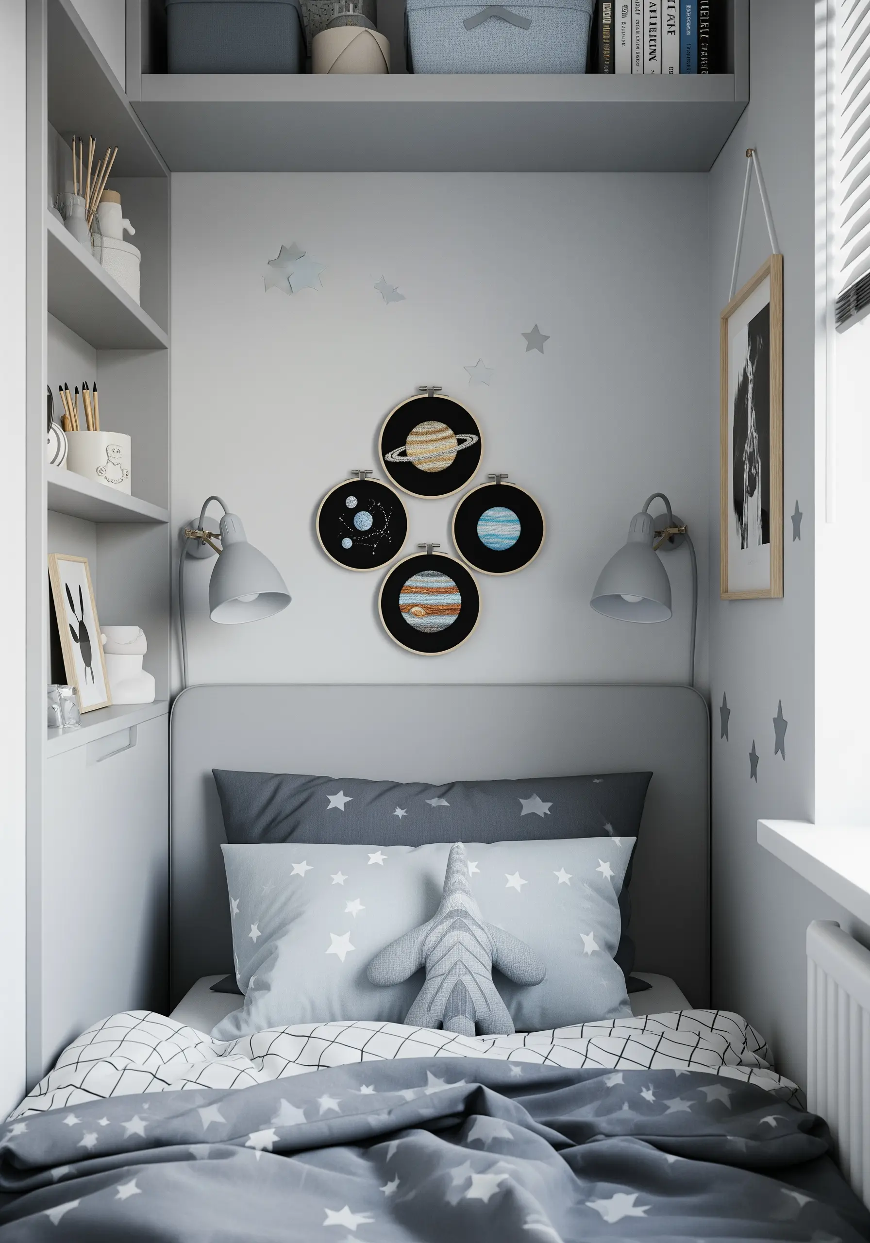 A collection of four small embroidery hoops, each depicting a different planet, hung on a wall.