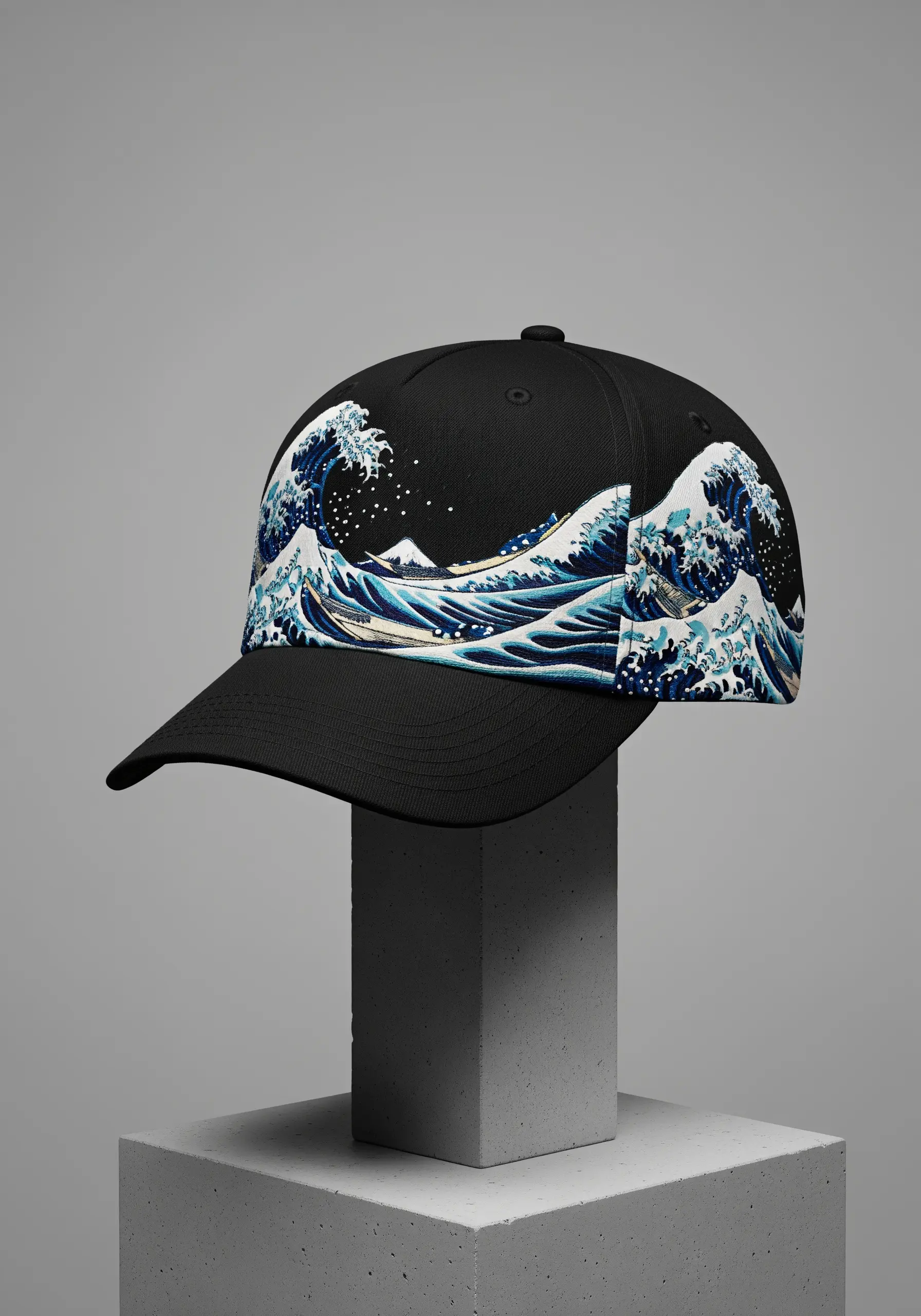 A black baseball cap featuring an embroidered patch of 'The Great Wave off Kanagawa'.