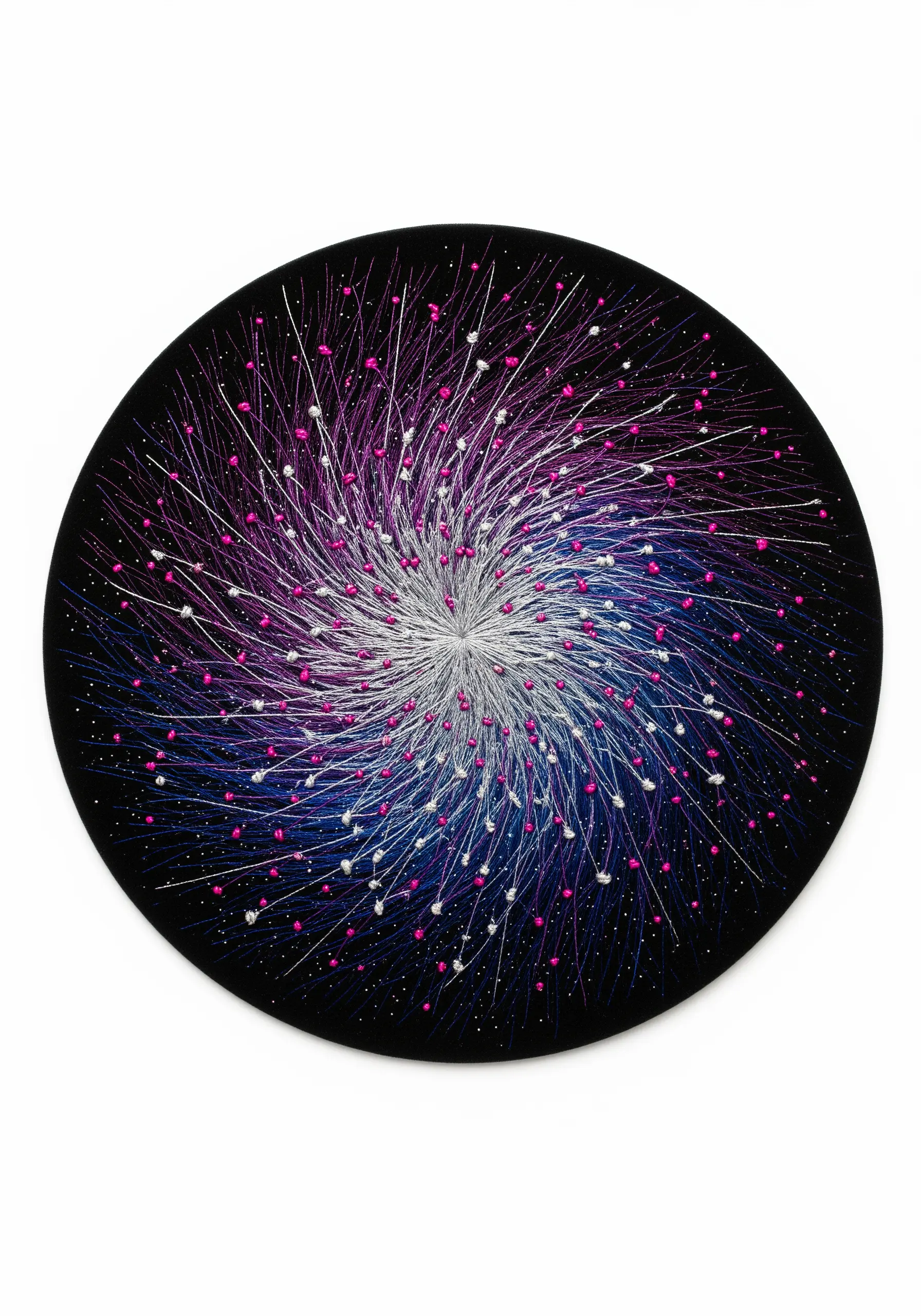 Abstract spiral embroidery in magenta, blue, and white with beads on black fabric.