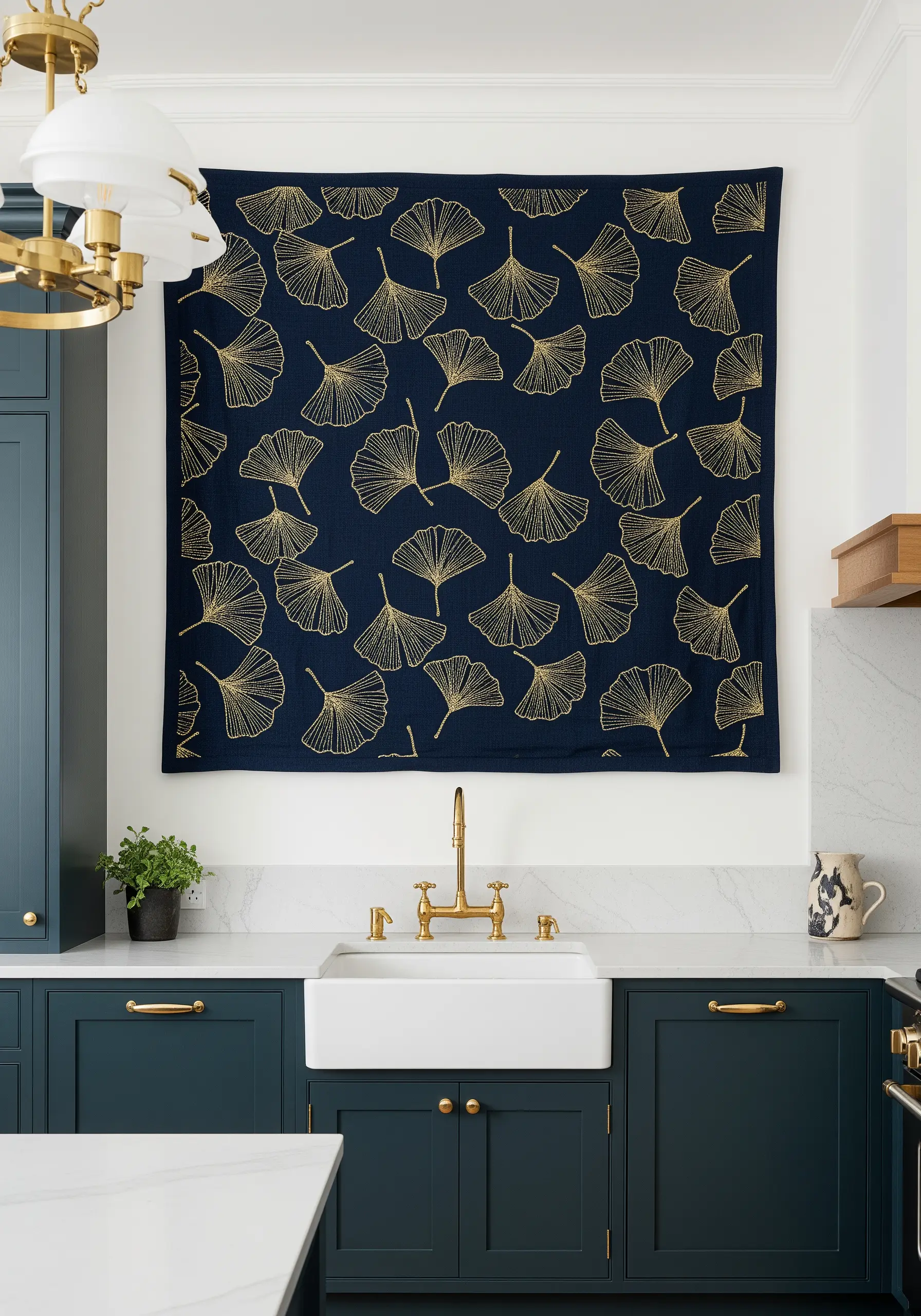 A large navy blue textile wall hanging with a repeating gold ginkgo leaf pattern over a sink.