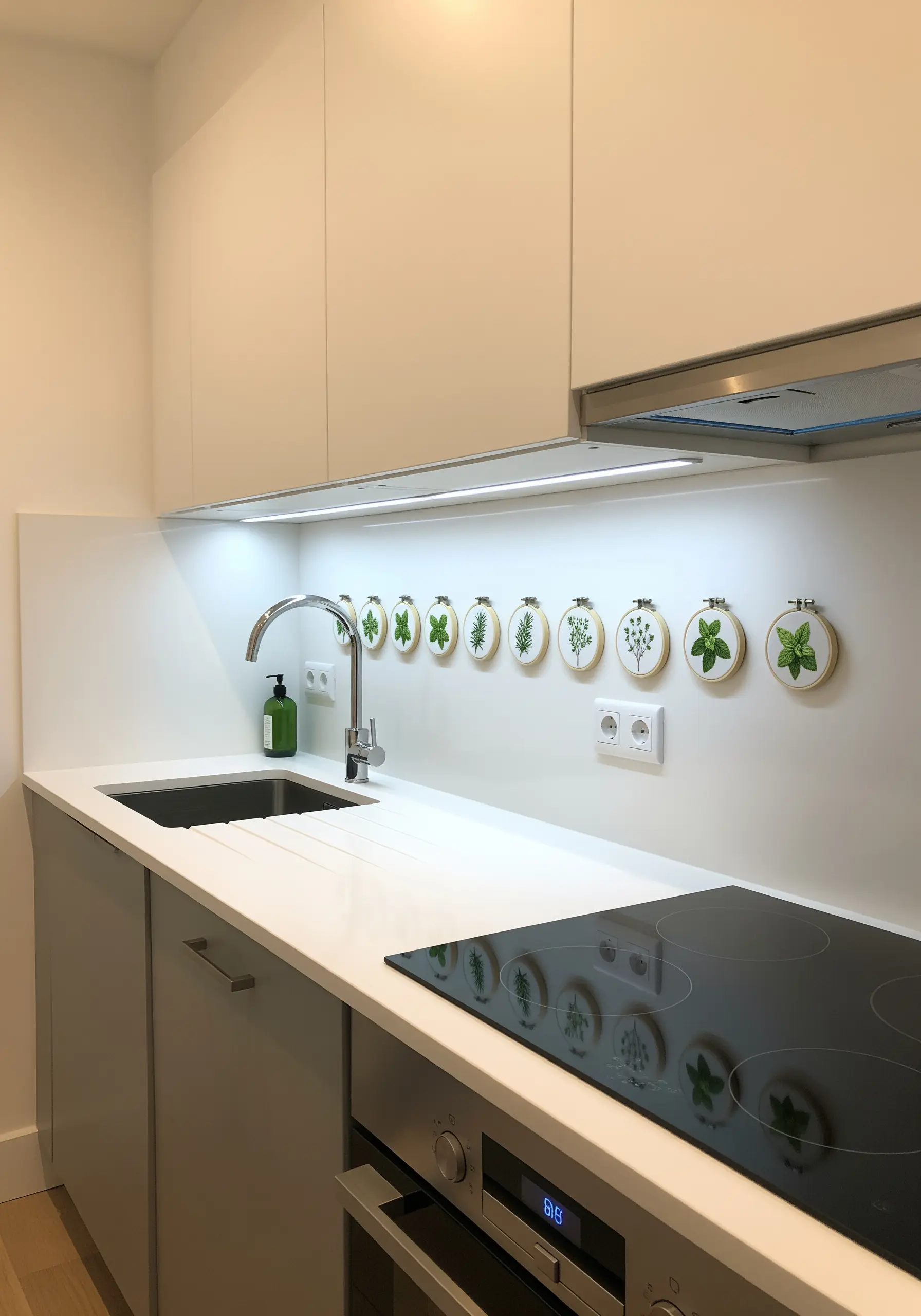 A horizontal line of nine small embroidery hoops featuring different herbs above a kitchen counter.