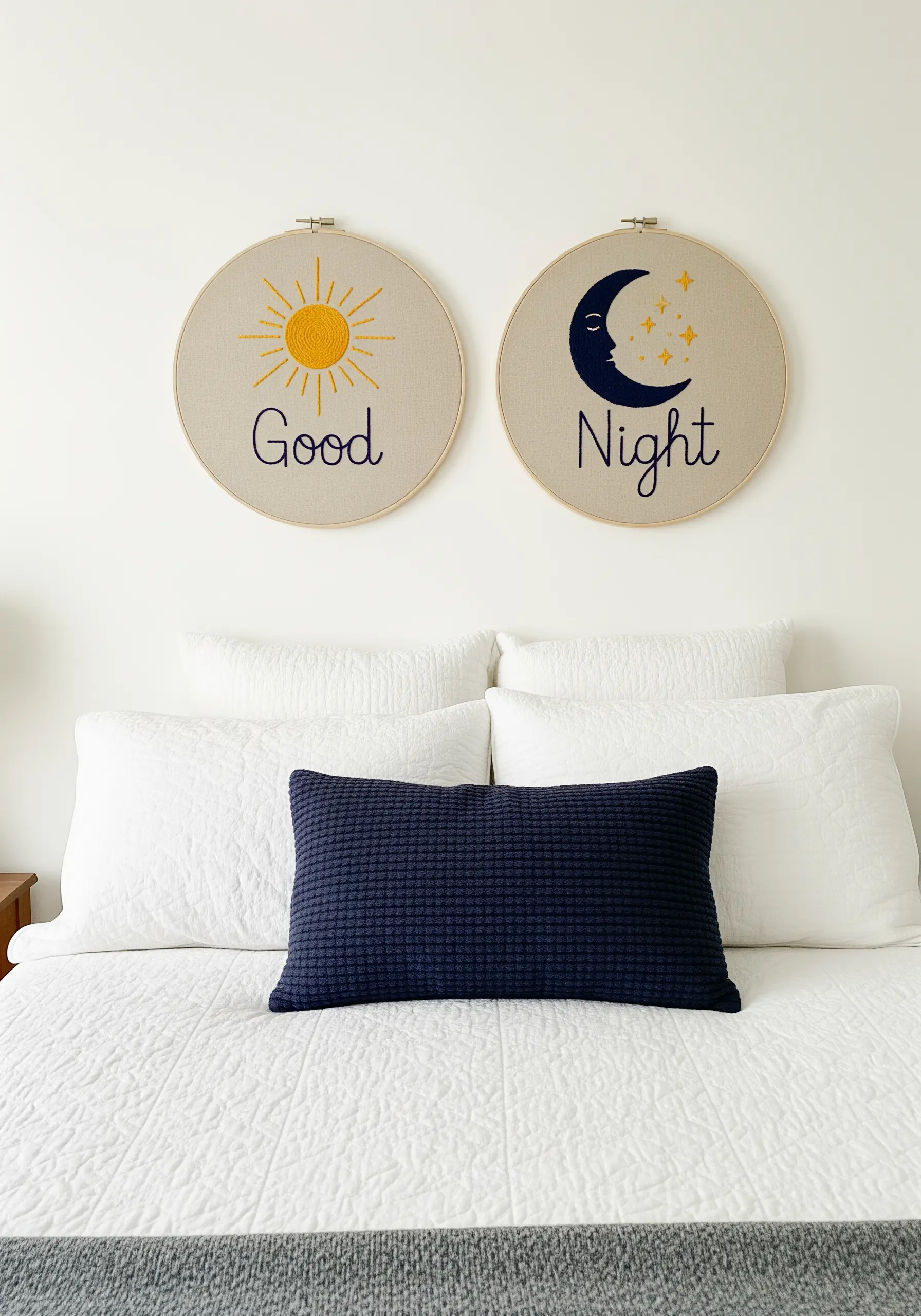 Two complementary embroidery hoops, one with a sun and 'Good,' the other a moon and 'Night.'