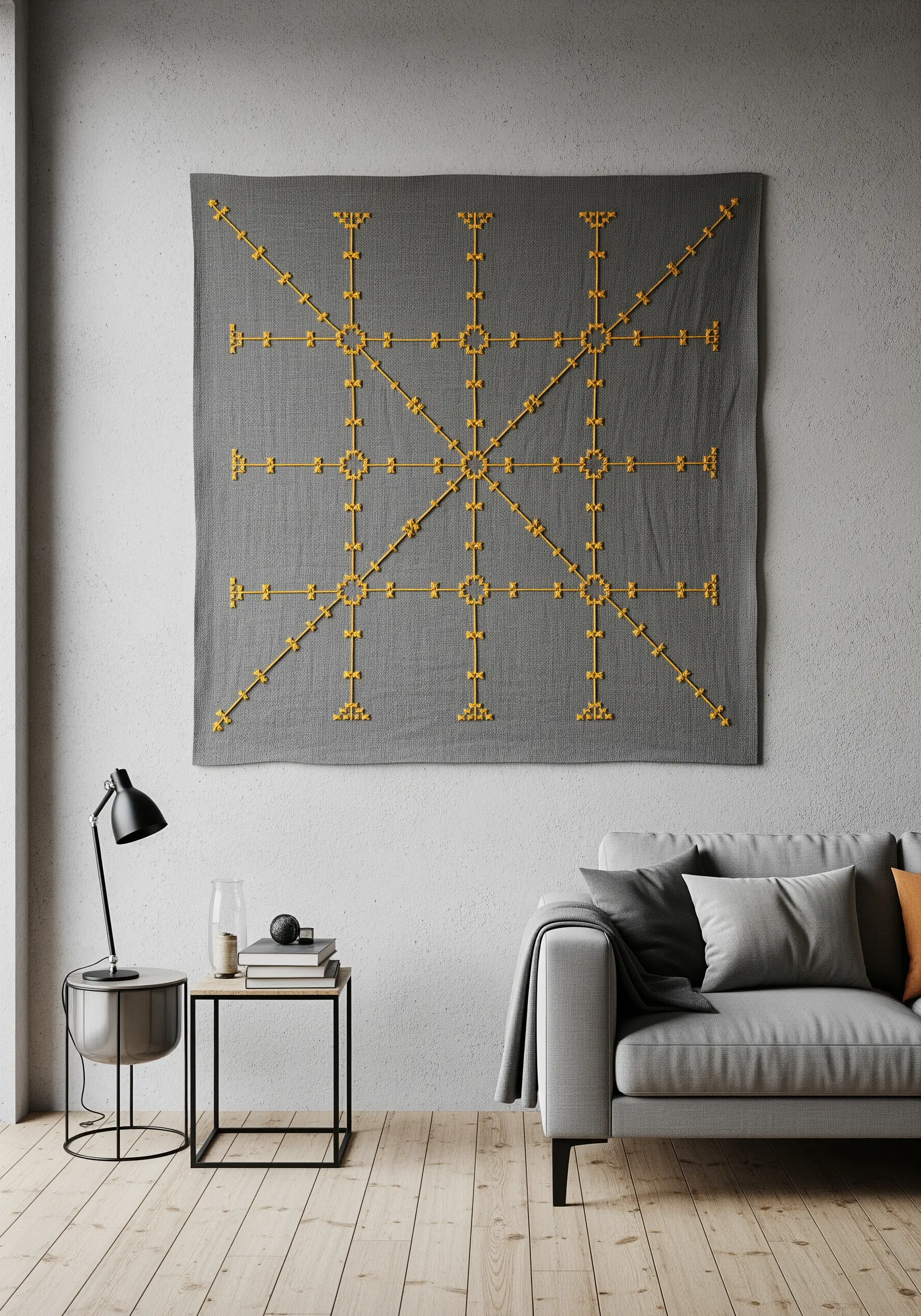 A large, gray fabric wall hanging with a geometric grid pattern stitched in yellow yarn