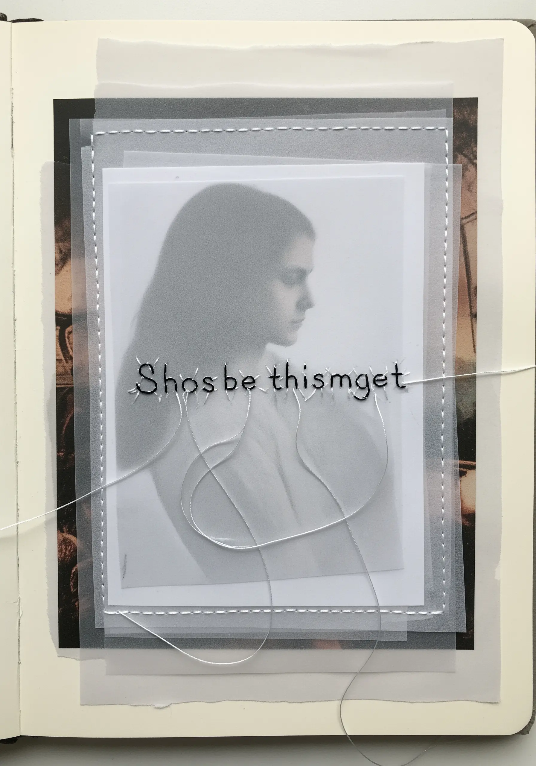 A collage with a photo layered under vellum, with stitched lettering and borders.