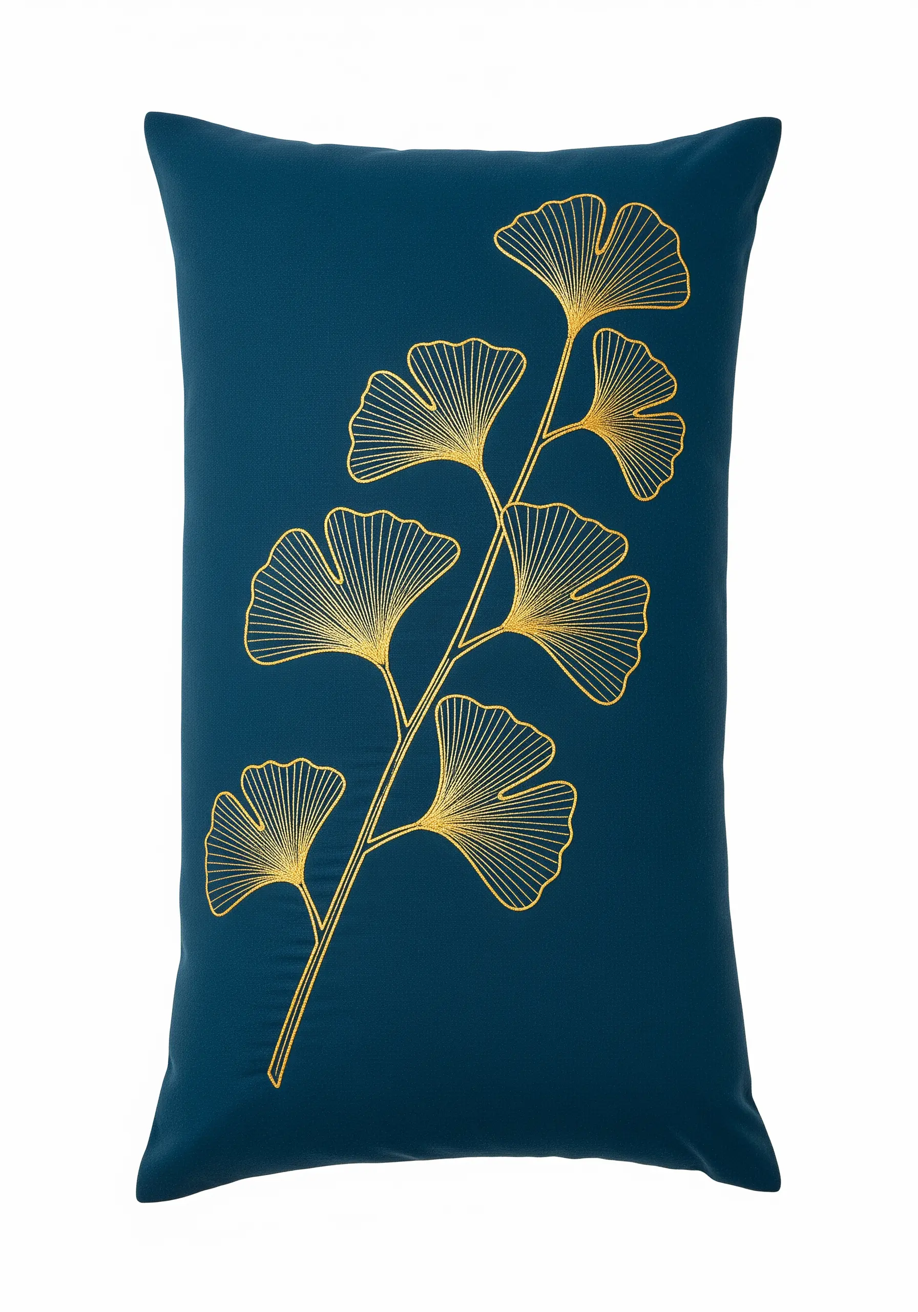 A minimalist golden ginkgo branch embroidered with precise lines on a dark teal pillow.