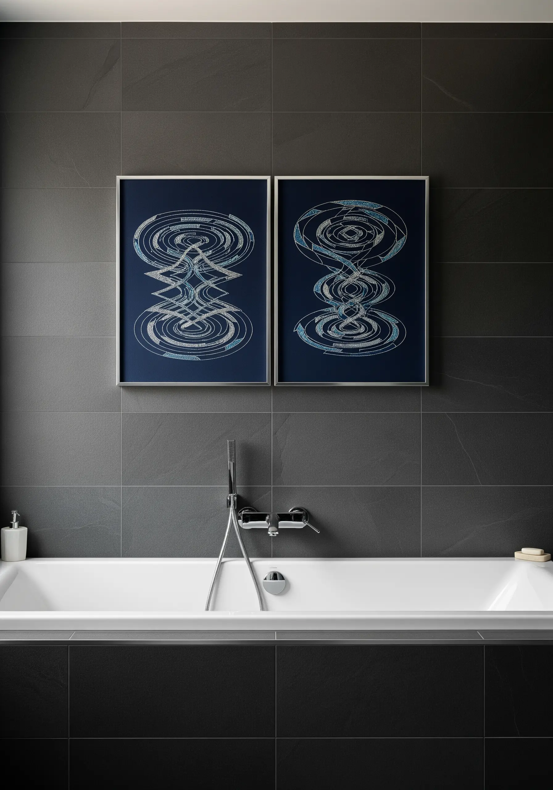 Two framed embroideries with complex, swirling concentric lines in white on blue.