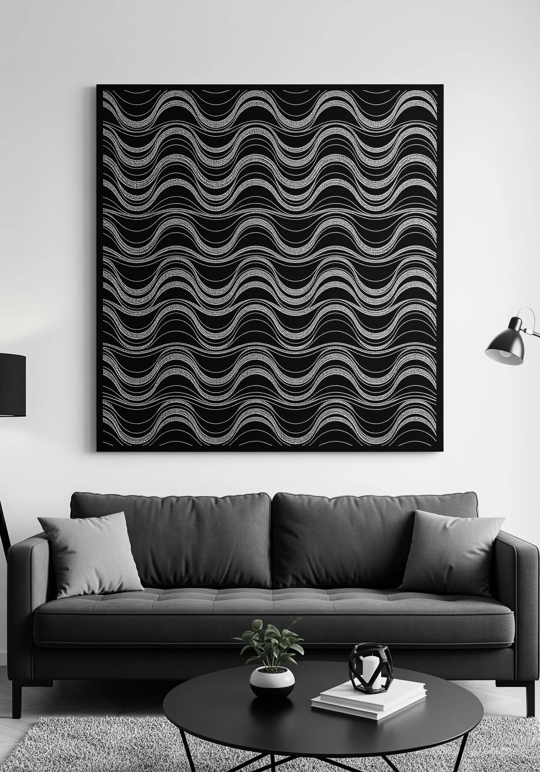 A large framed piece of black fabric with a repeating wave pattern stitched in silver metallic thread.