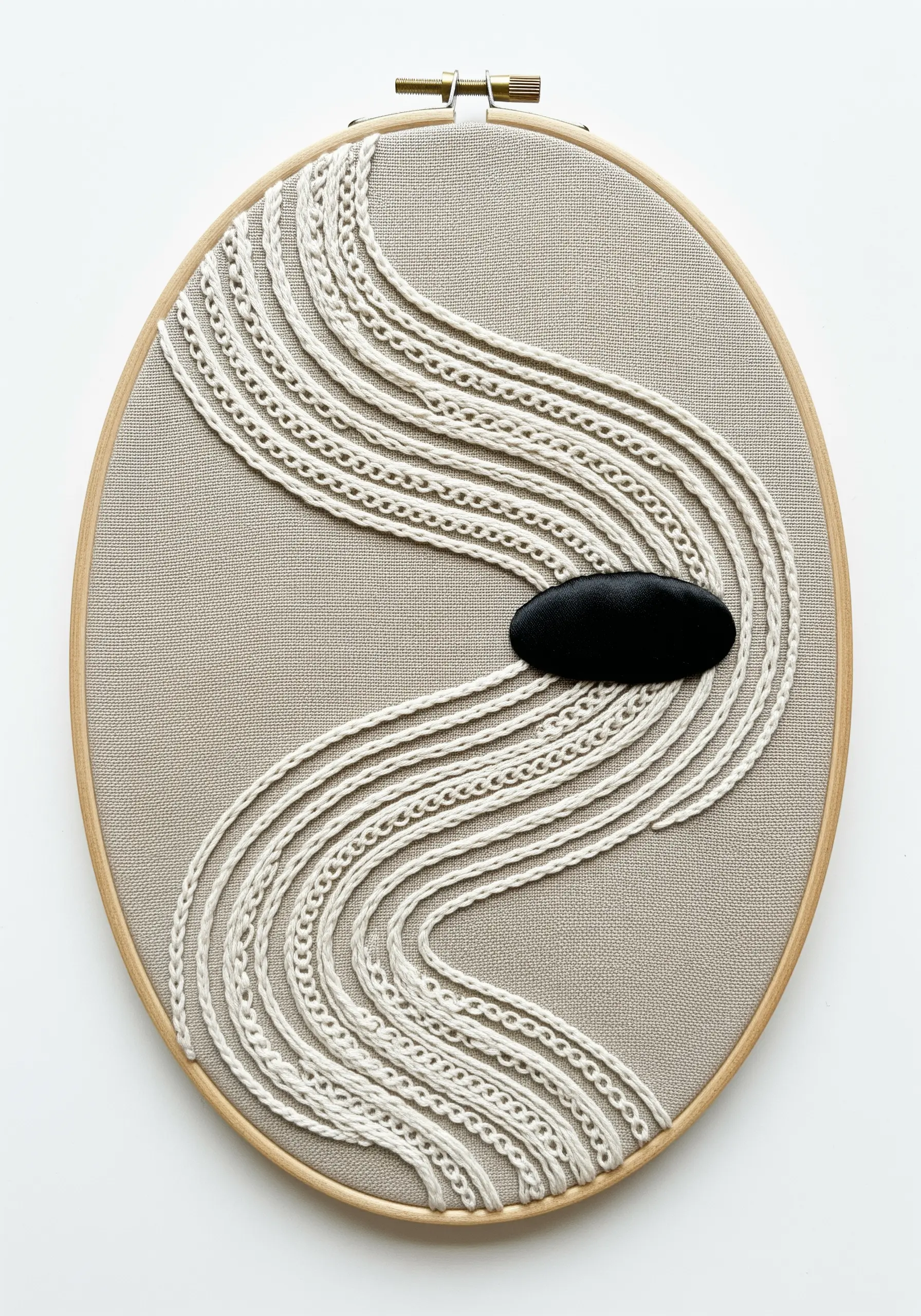 Abstract embroidery with flowing, textured lines in off-white thread on a neutral background.