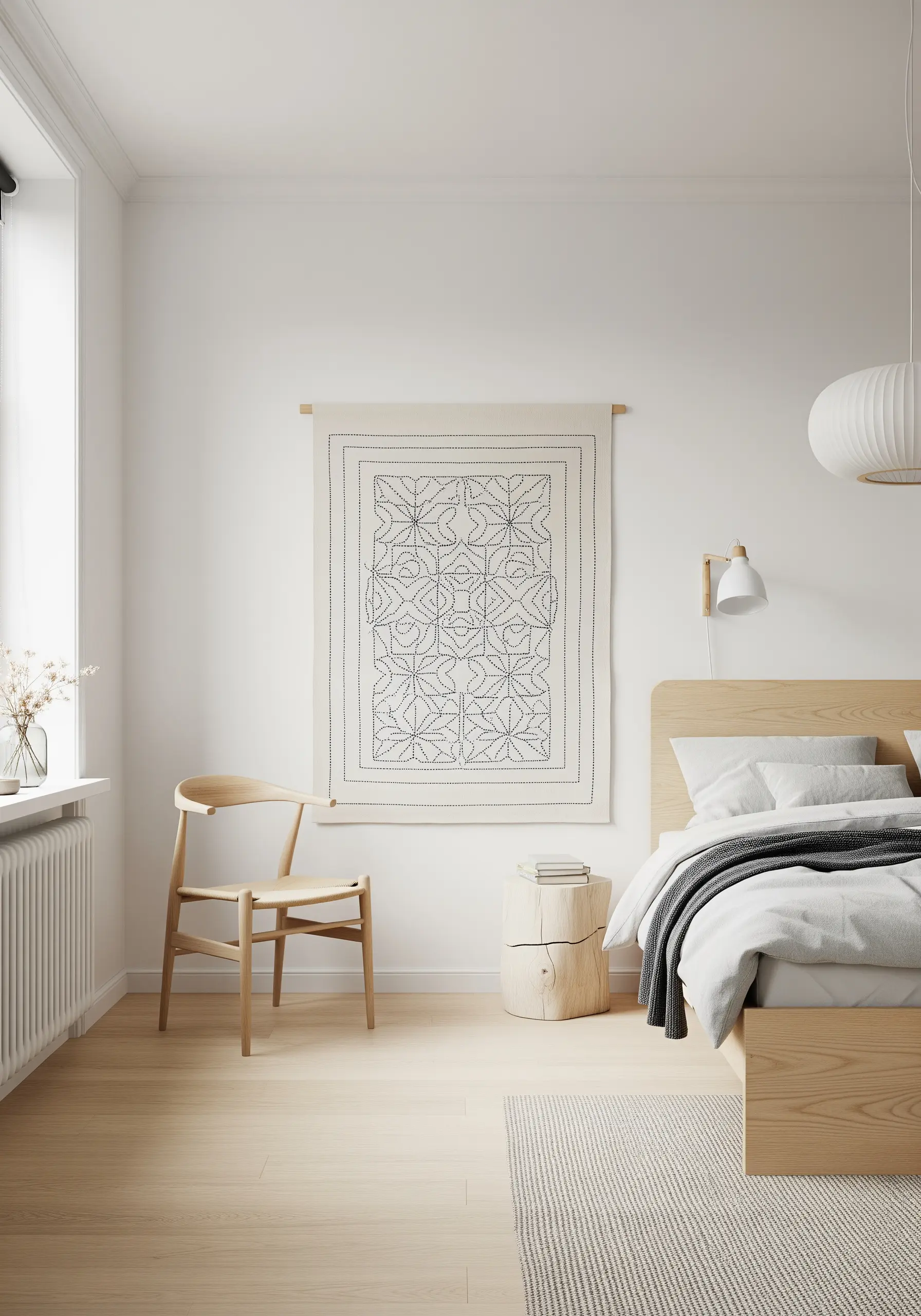 A minimalist wall hanging with a geometric pattern in running stitch, in a Scandinavian-style bedroom.