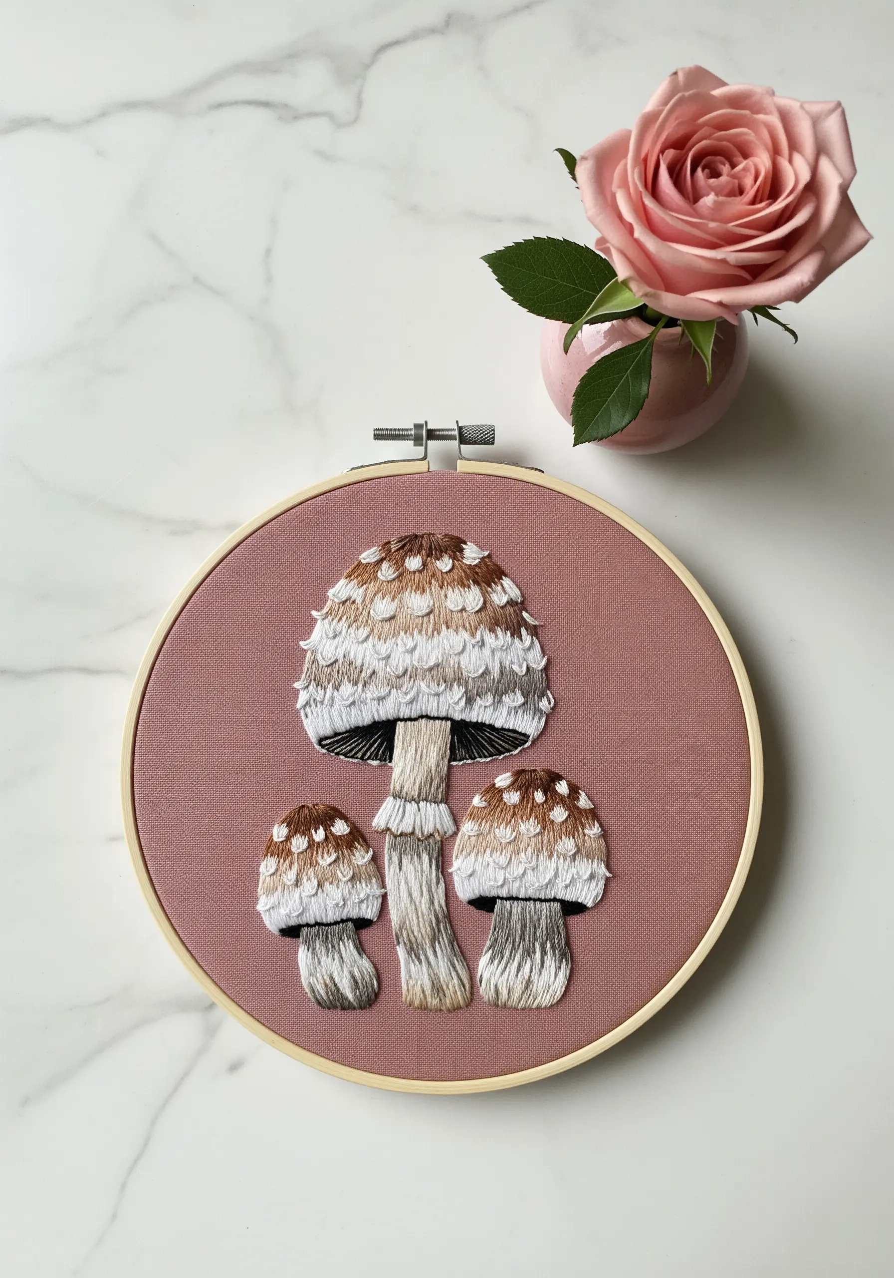 Shaggy mane mushrooms with a dimensional, frayed texture created with cut loop stitches.