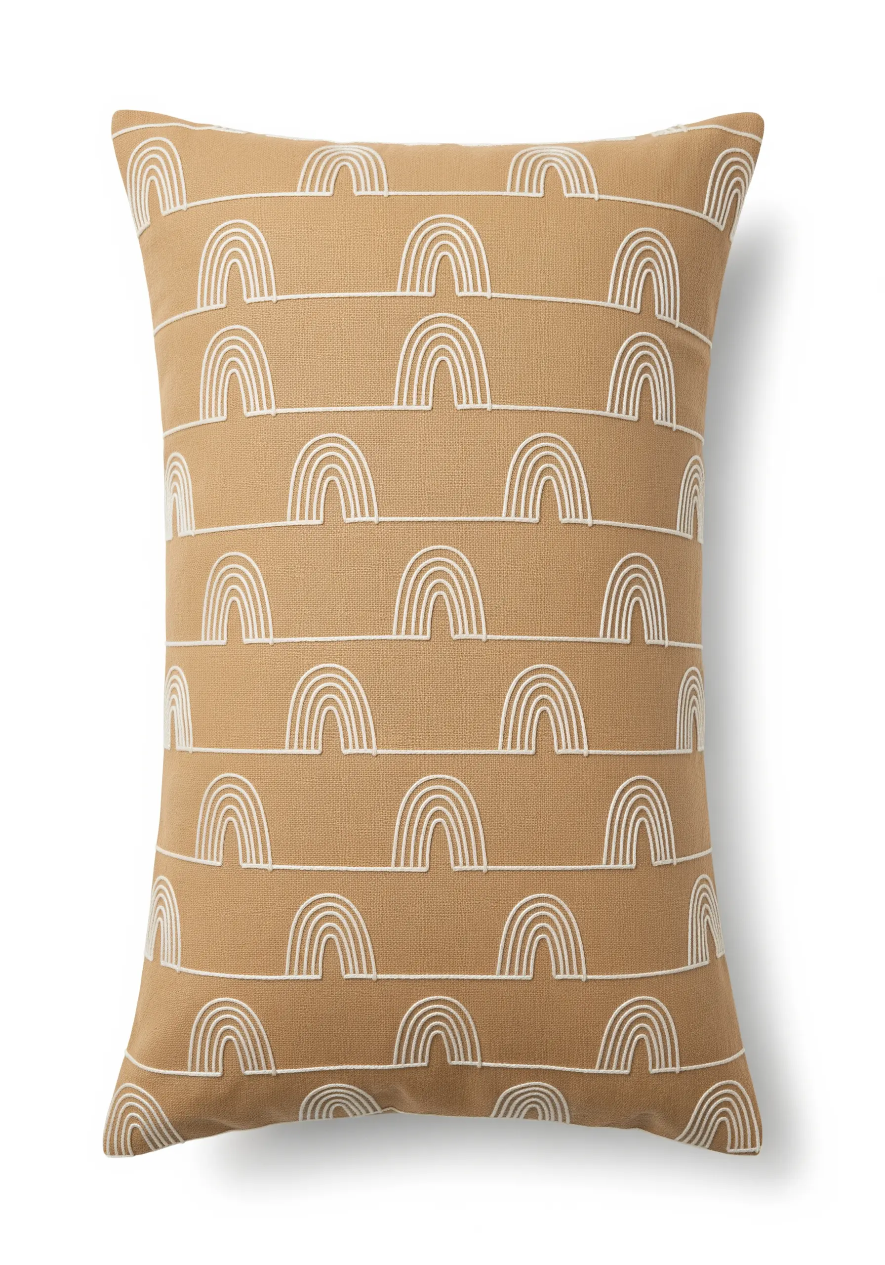 A repeating pattern of small white rainbow arcs embroidered on a camel-colored cushion.