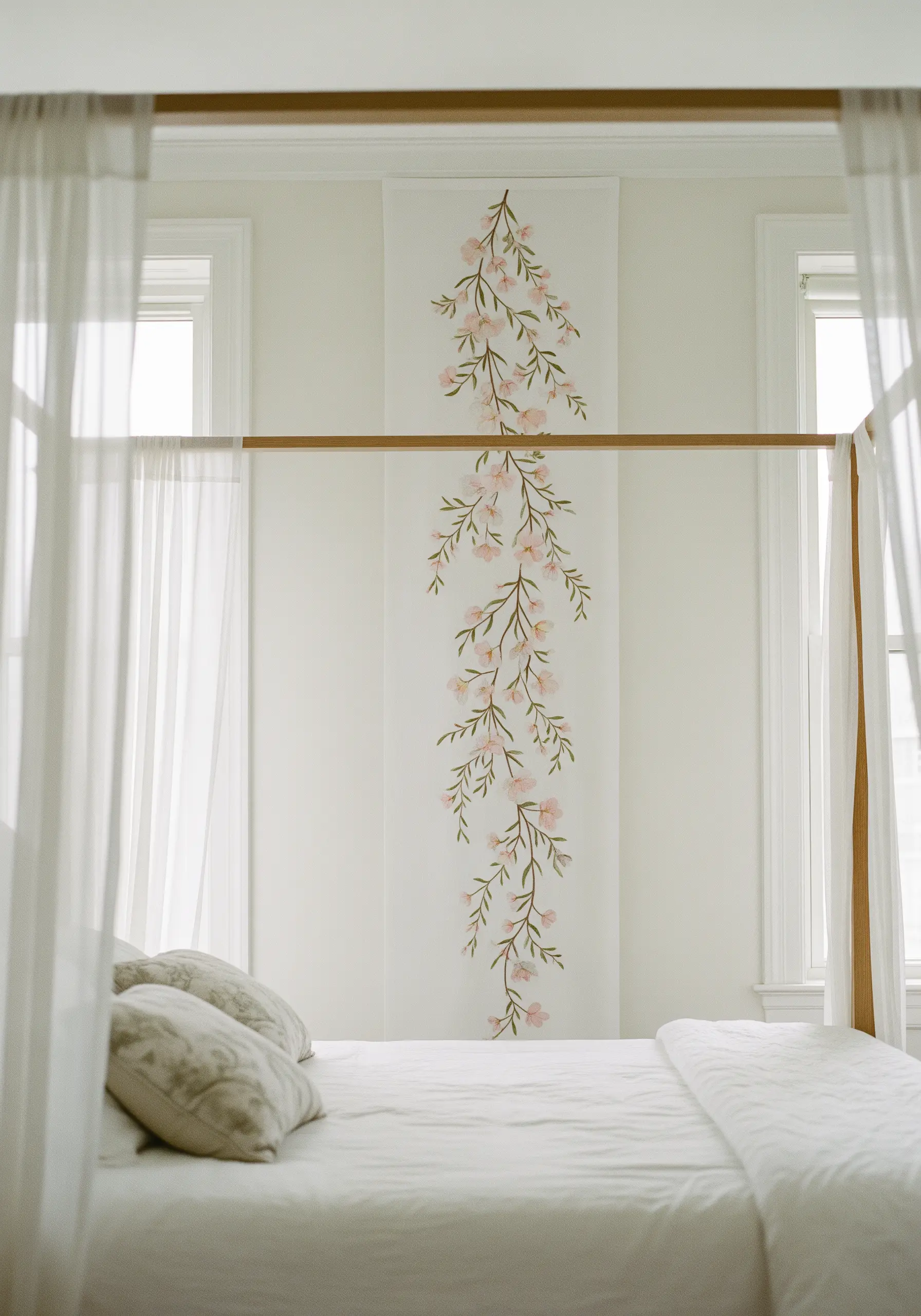 A long, vertical embroidered wall hanging with cascading pink cherry blossoms.
