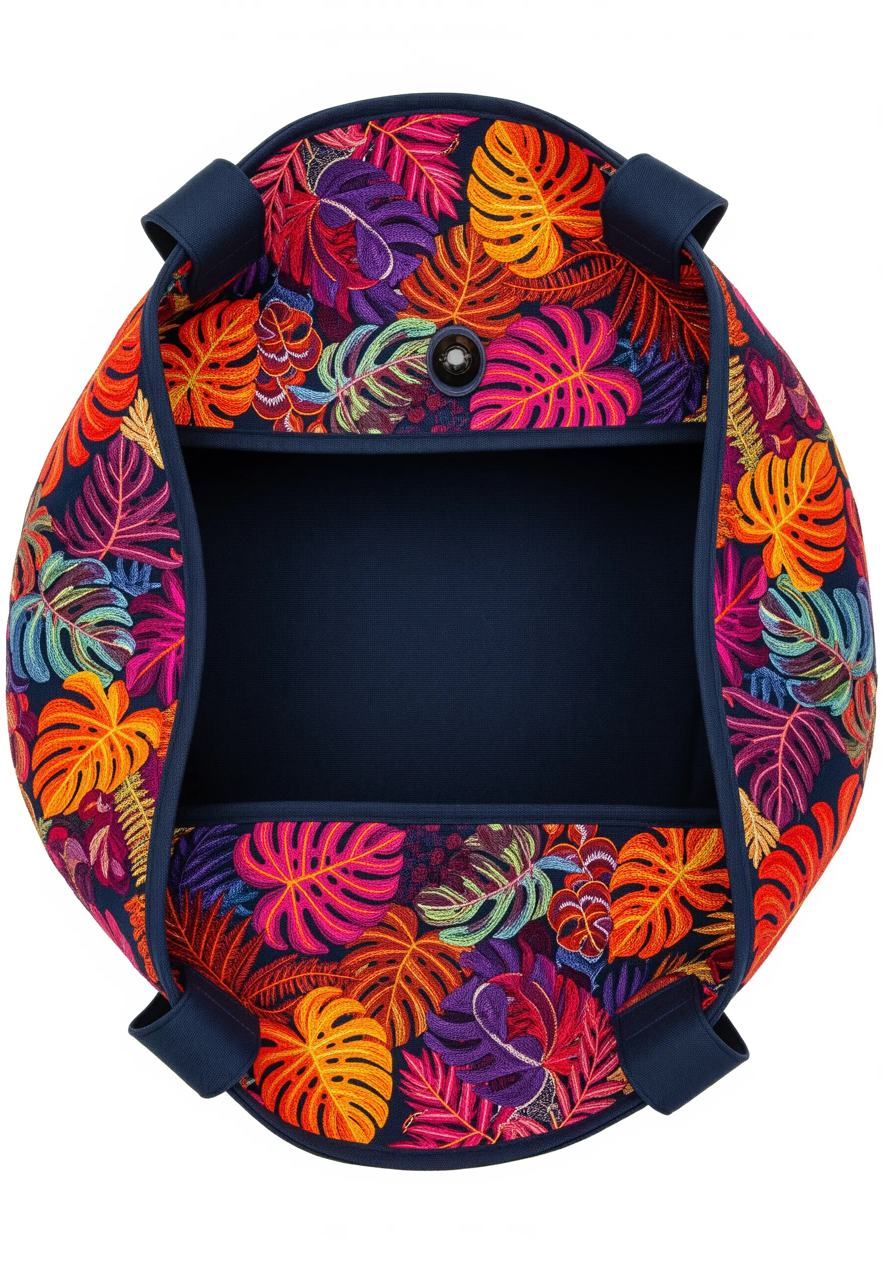 A densely embroidered tote bag covered in colorful, overlapping tropical leaves.