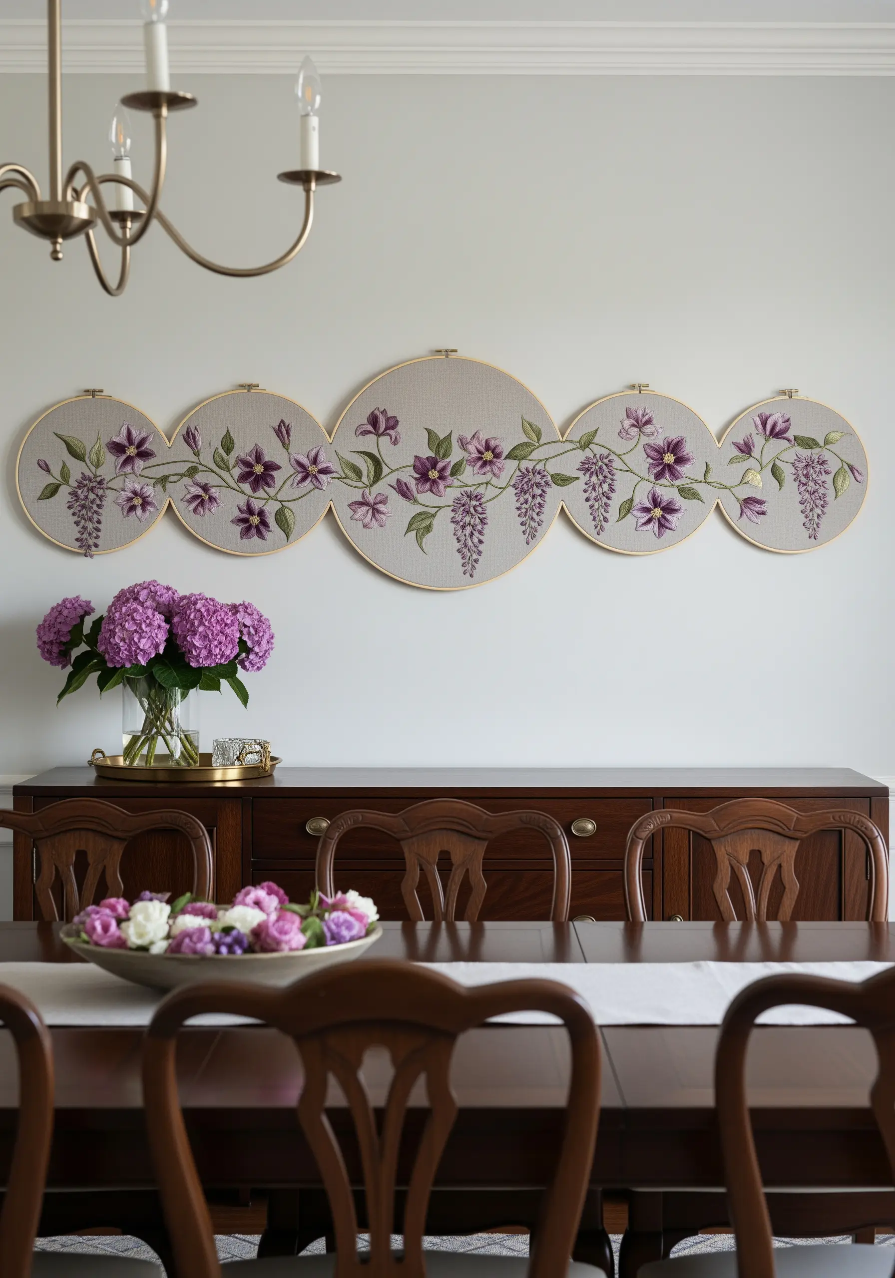A flowing wisteria vine embroidered across five interconnected hoops of varying sizes.