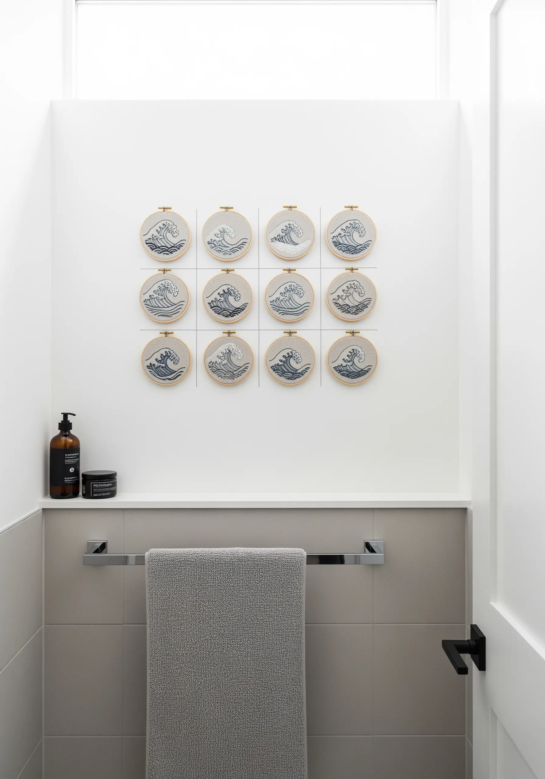 A 3x4 grid of twelve embroidery hoops, each showing a variation of an ocean wave.