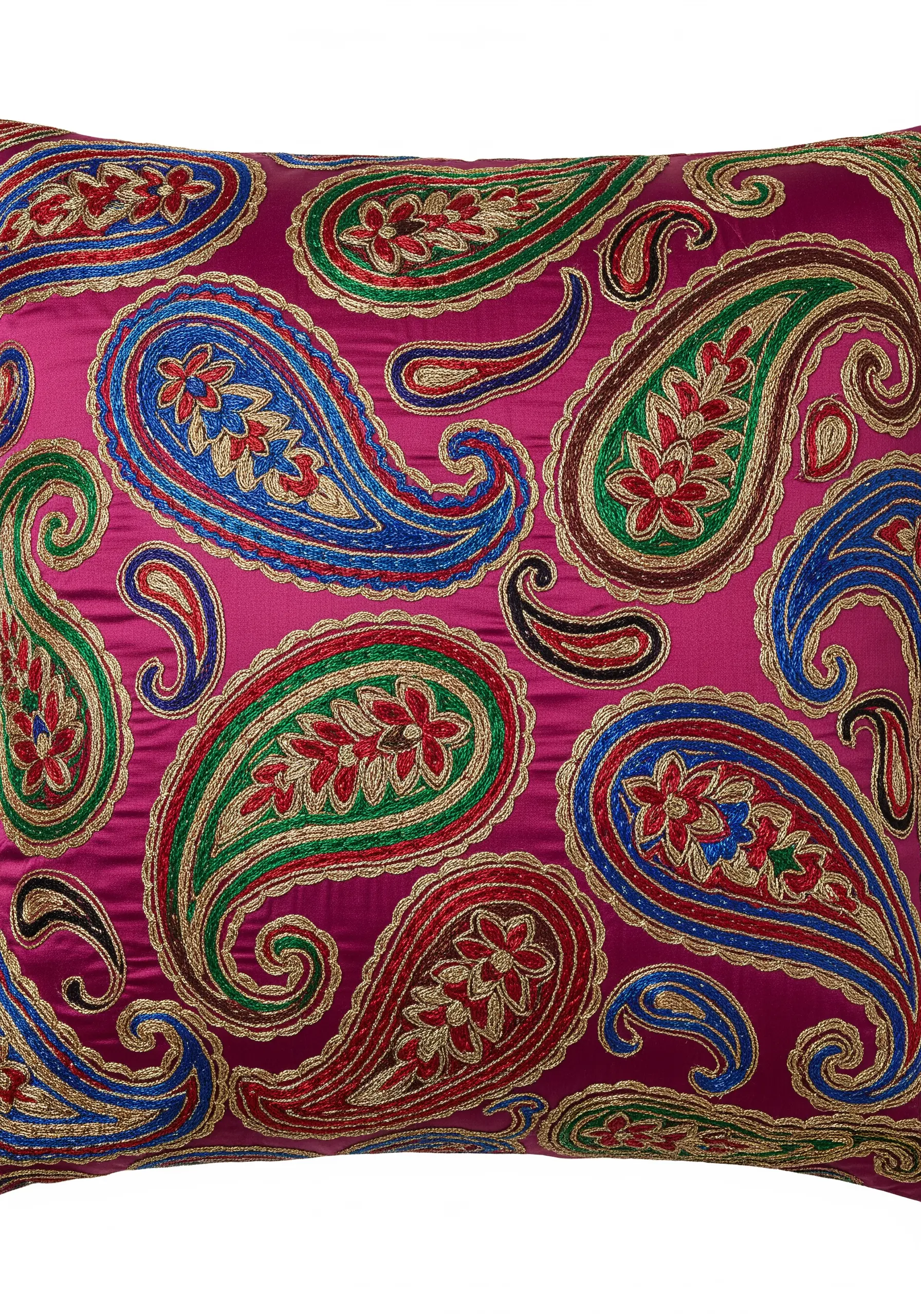 Intricate paisley embroidery on a pink pillow with gold metallic thread outlines.