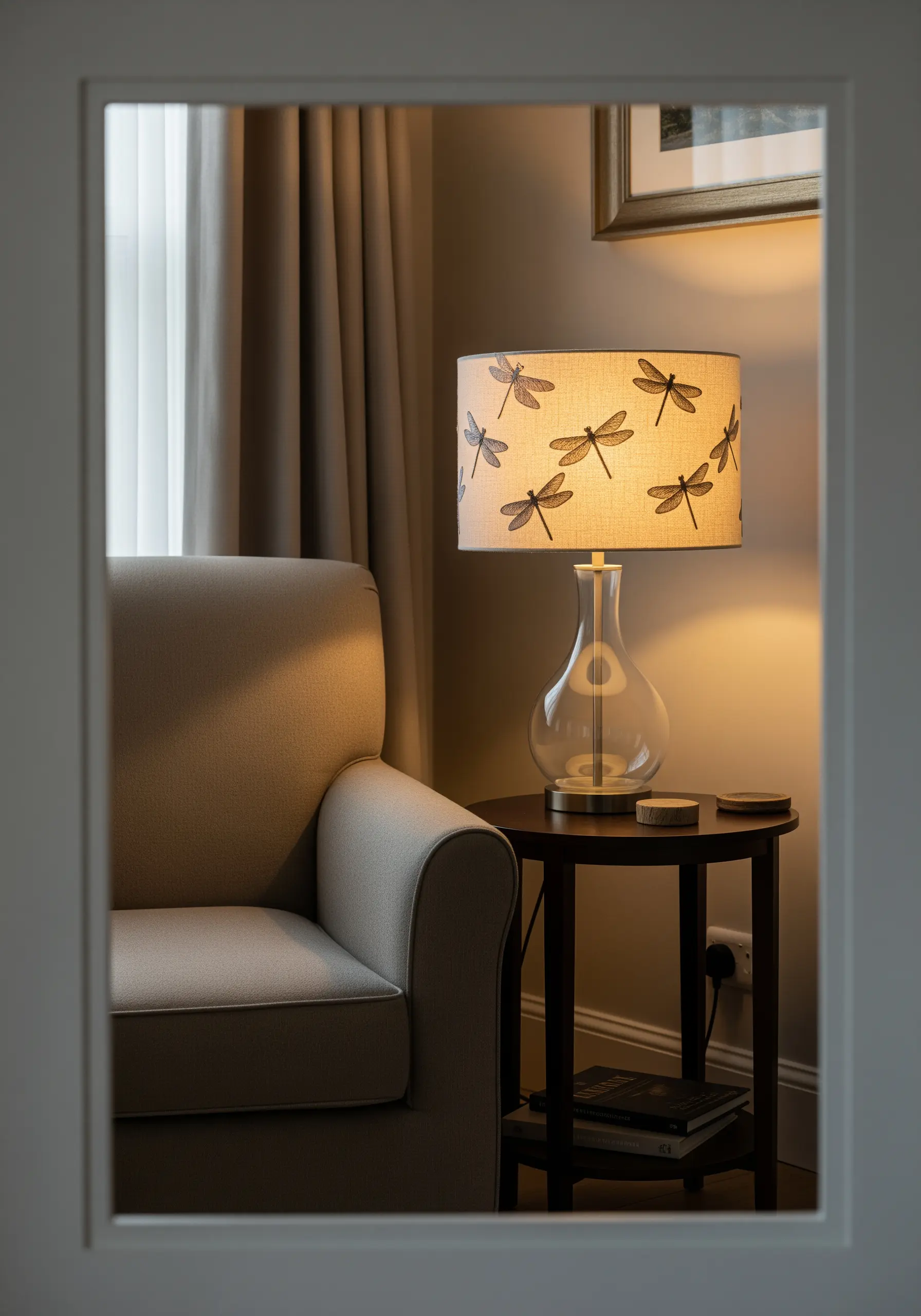 Dragonfly motifs embroidered in a simple backstitch around a fabric lampshade.