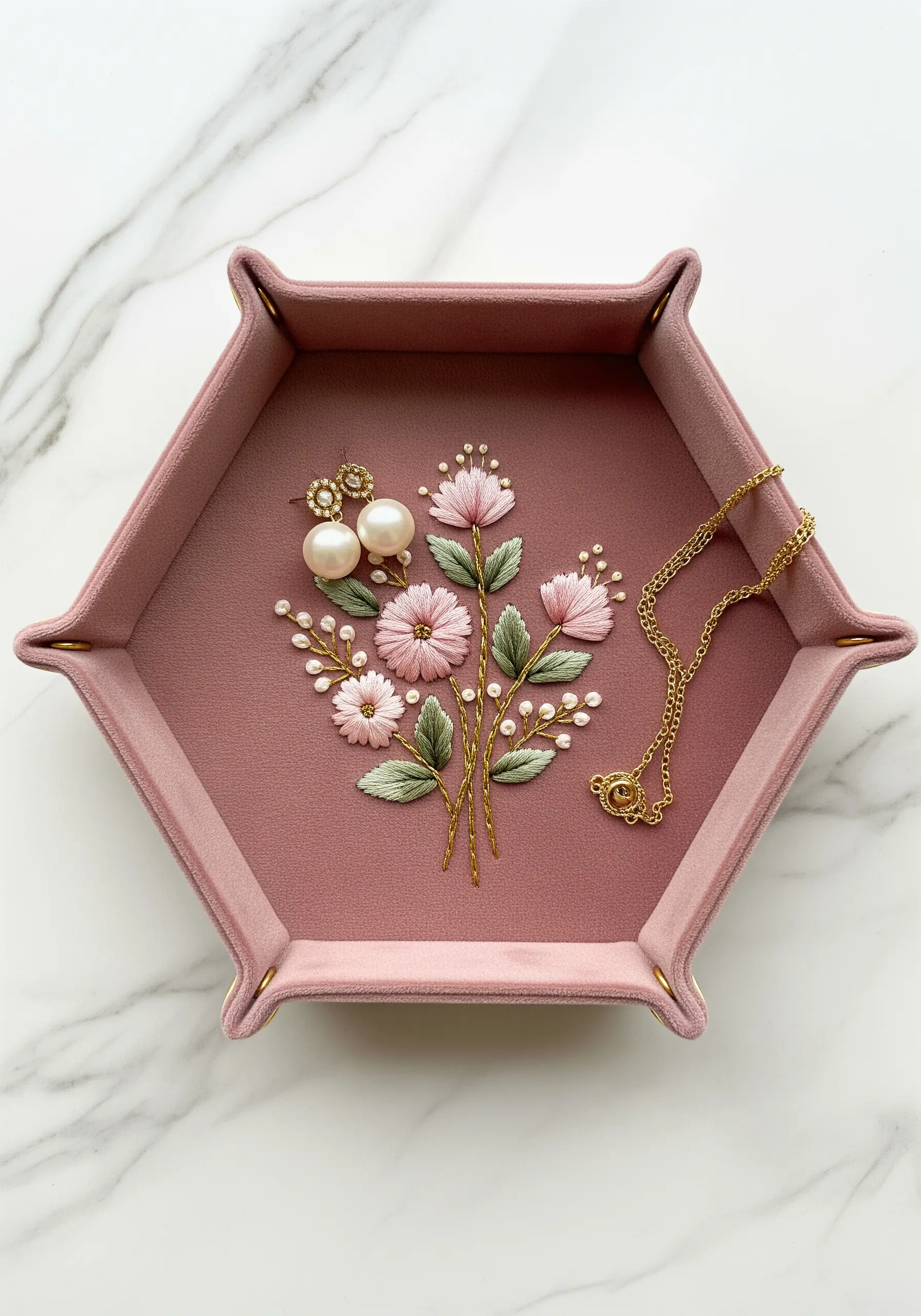 Pink suede valet tray embroidered with a delicate bouquet of pink flowers and pearls.