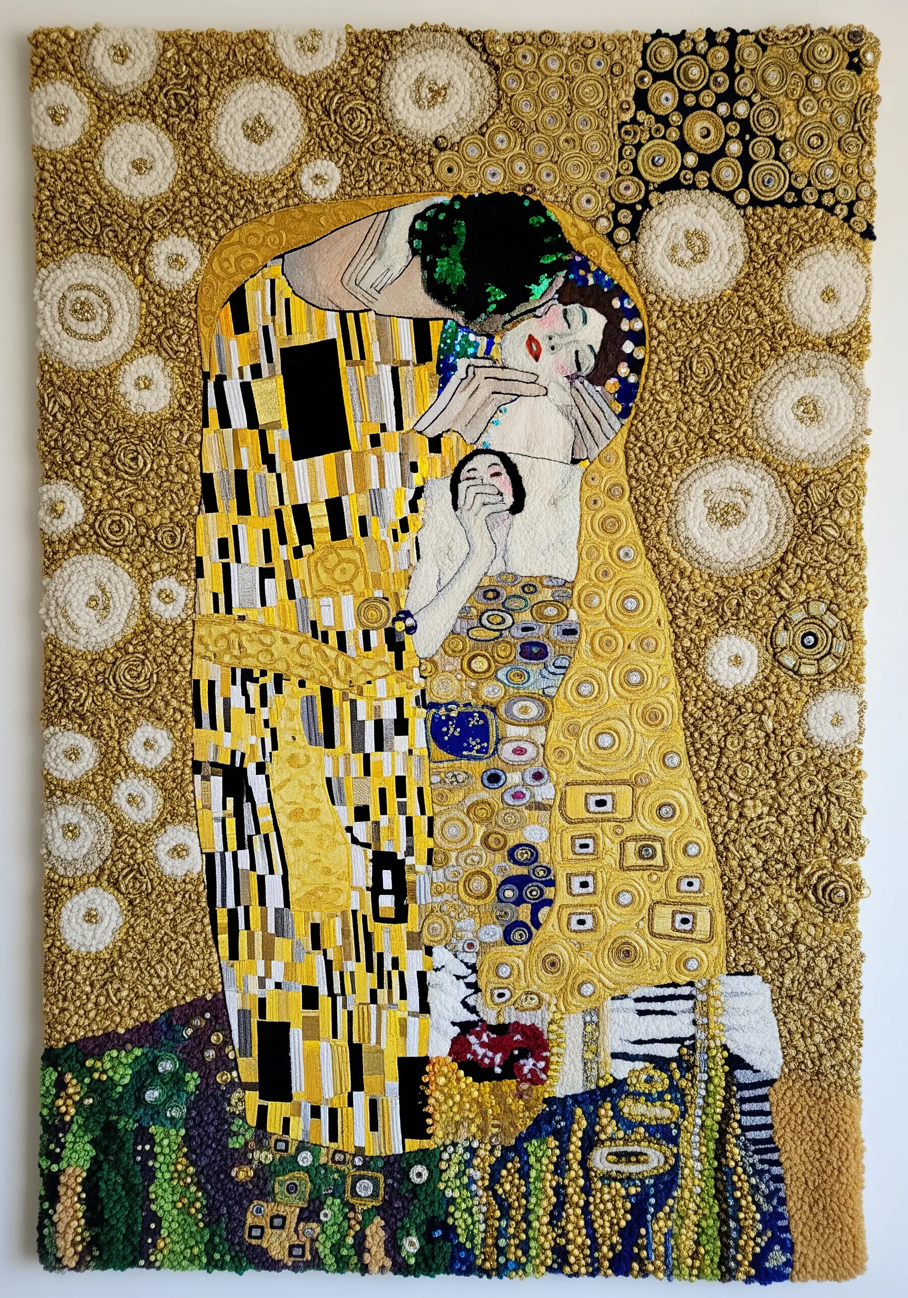 Fiber art of Klimt's The Kiss, rich with gold thread, French knots, and couched yarn swirls.
