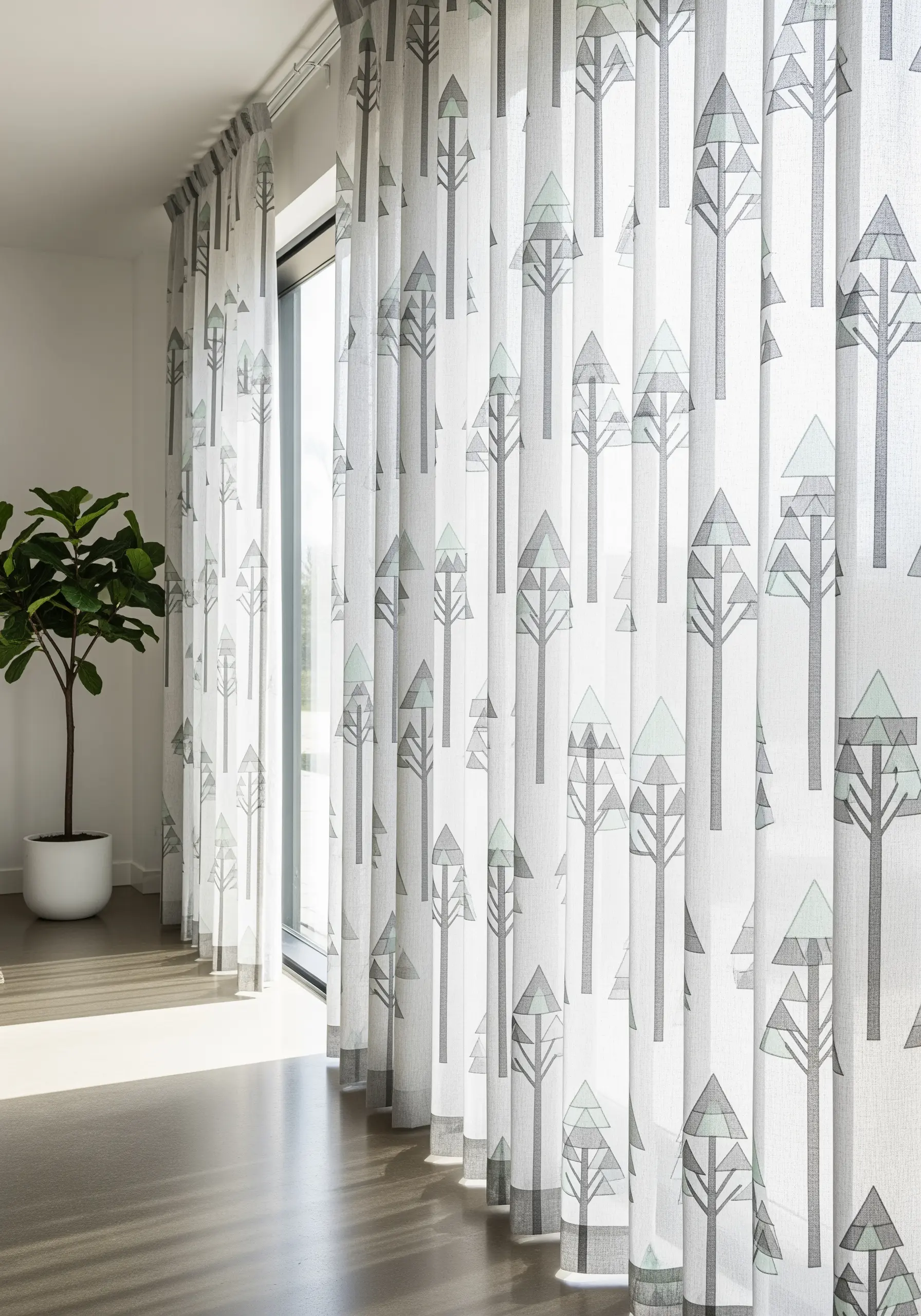 Geometric tree pattern embroidered on semi-sheer white curtains, letting light through.