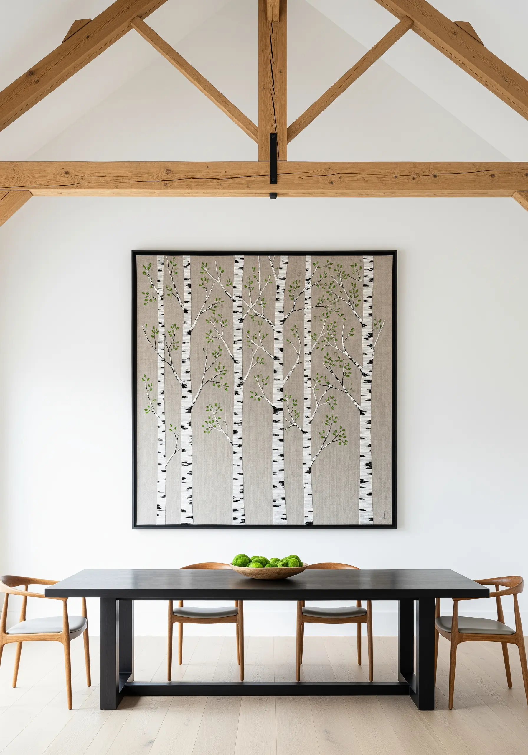 Large framed embroidery of a forest of birch trees with green leaves.