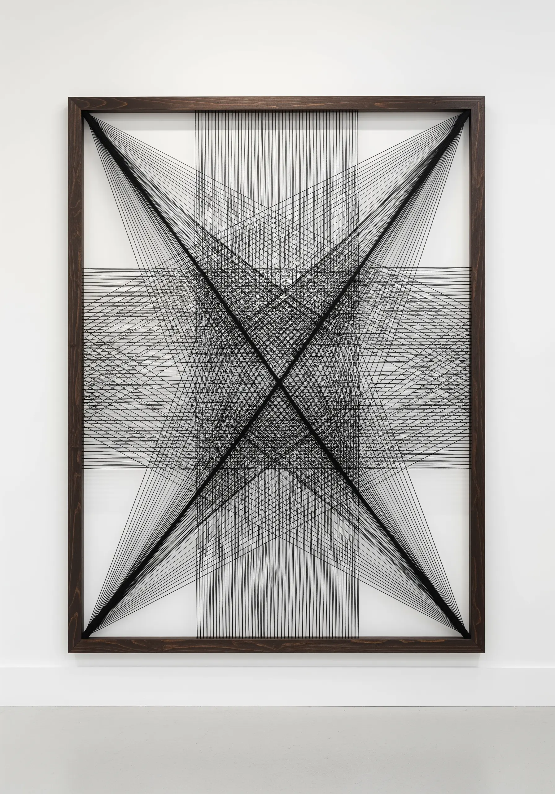 Geometric string art with black thread stretched across a square frame, creating layered patterns