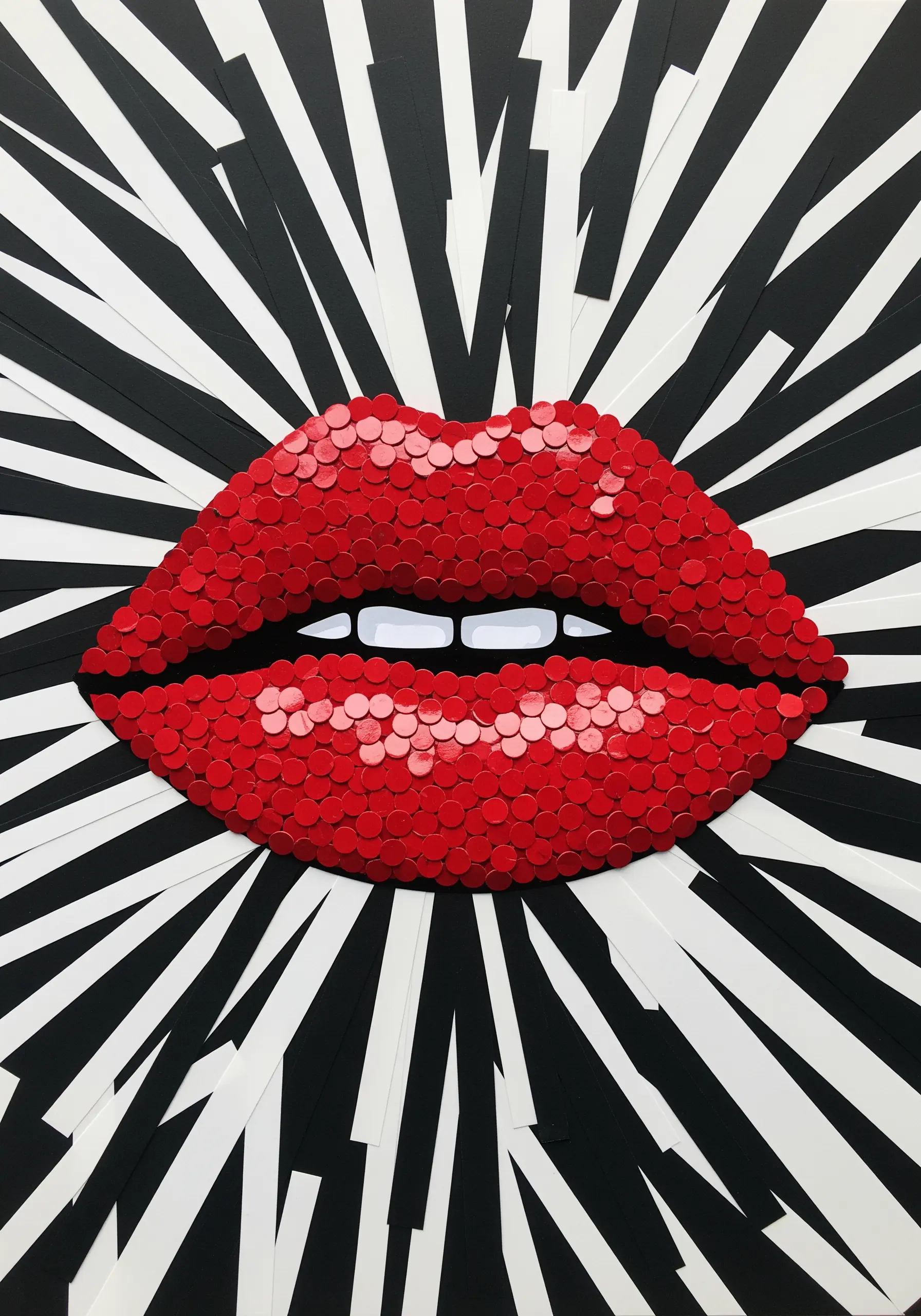 Pop art lips filled with overlapping red paper circles against a black and white background.