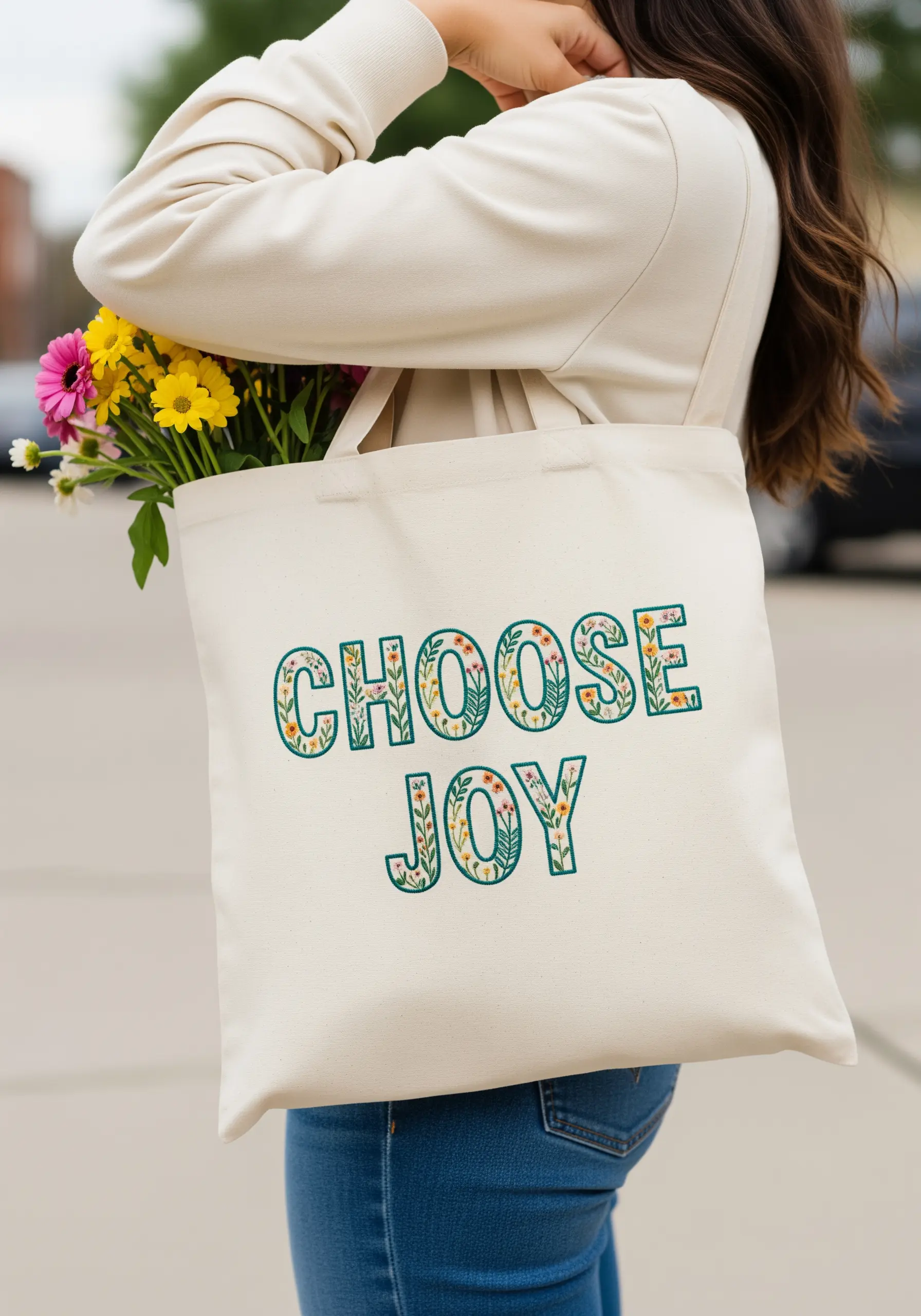 The words 'Choose Joy' with each letter filled with tiny, colorful embroidered flowers and leaves.