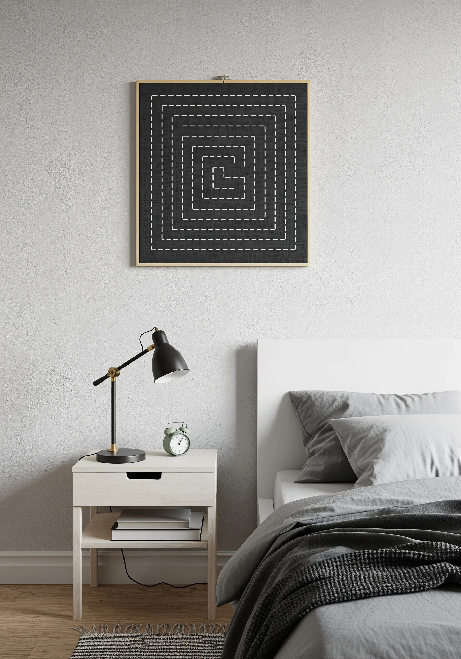 A square embroidery hoop with a geometric maze stitched in white running stitch on black fabric.